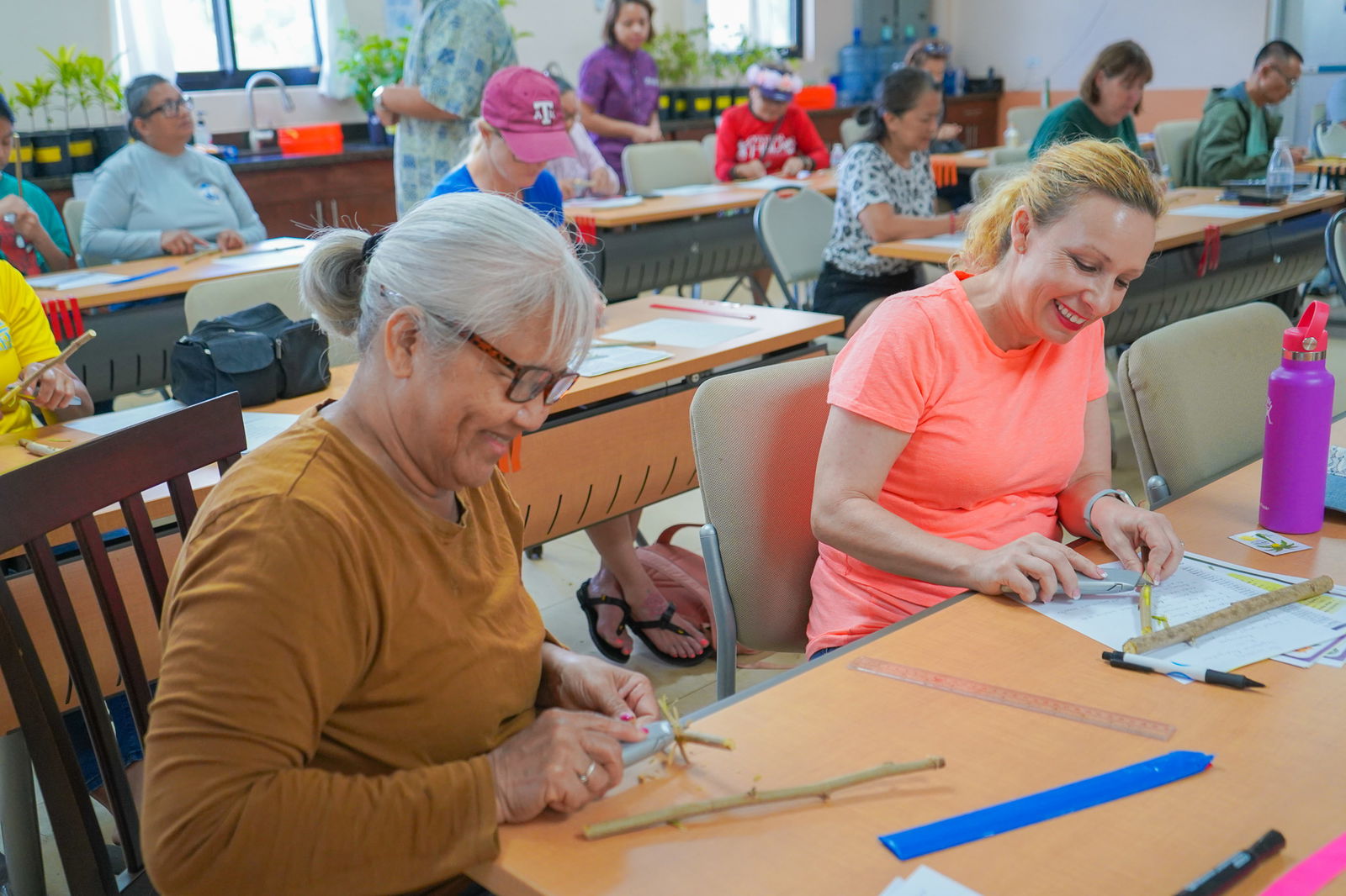 Teresa Cruz, left, and Katherine Day practice the propagation technique of air layering at a fruit production workshop on March 9 at the University of Guam’s agricultural research station in Yigo. The university will be hosting an Avocado Production Workshop on Saturday, June 1.
