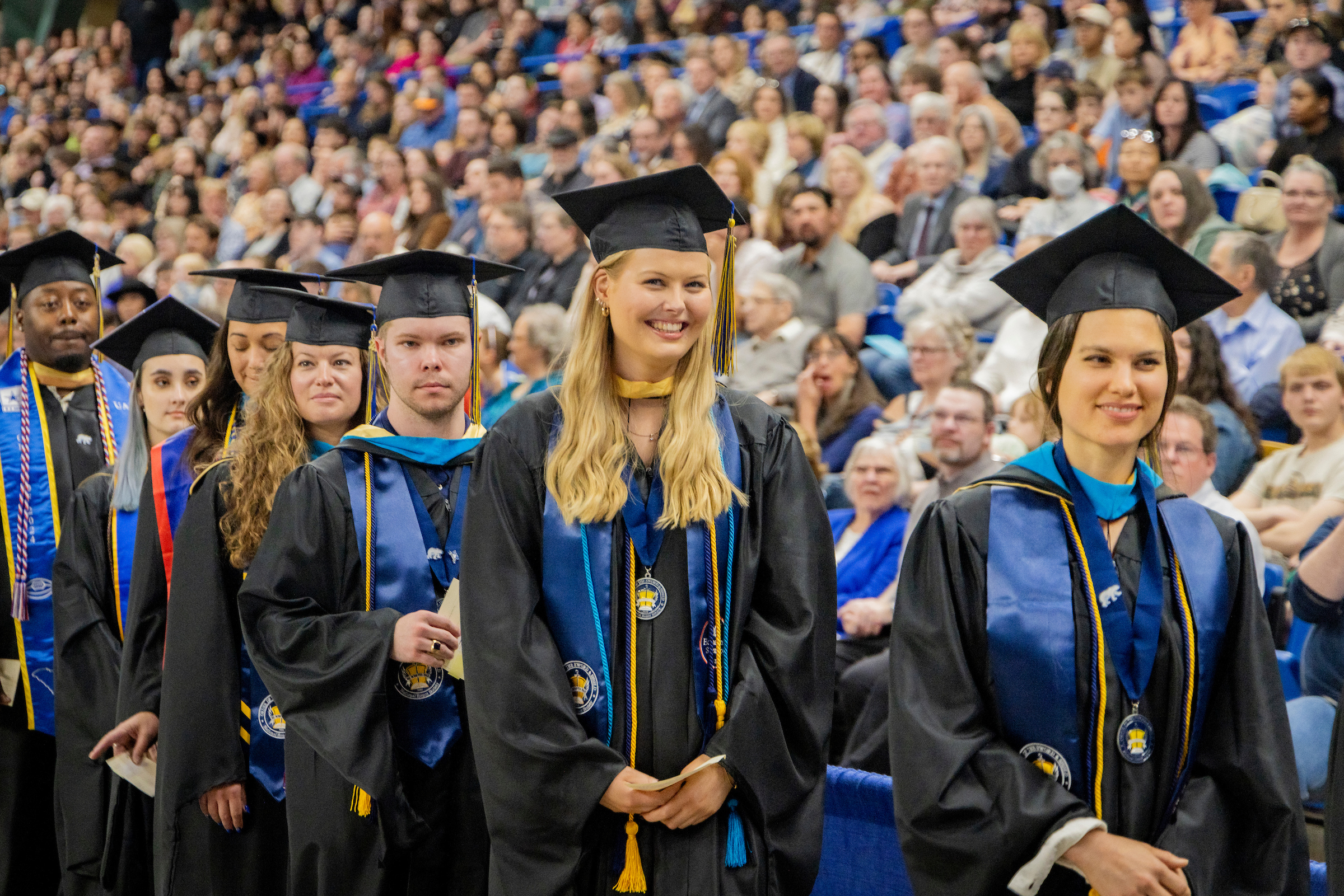 Graduates line up to receive their diplomas at the University of Alaska Fairbanks 2024 commencement ceremony on May 4, 2024.