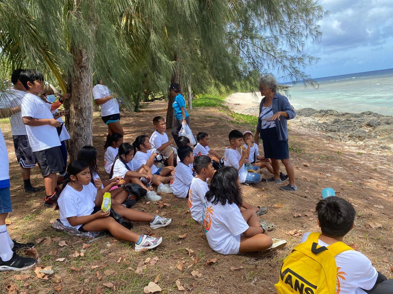 Third grade students of Tinian Elementary School in learn firsthand about tourism as “Tourists for a Day” on May 23, 2024. Tourific Tinian’s tour guide and operator Deborah Fleming, standing right, teaches during a historic sites tour organized by the Marianas Visitors Authority as part of Marianas Tourism Month.