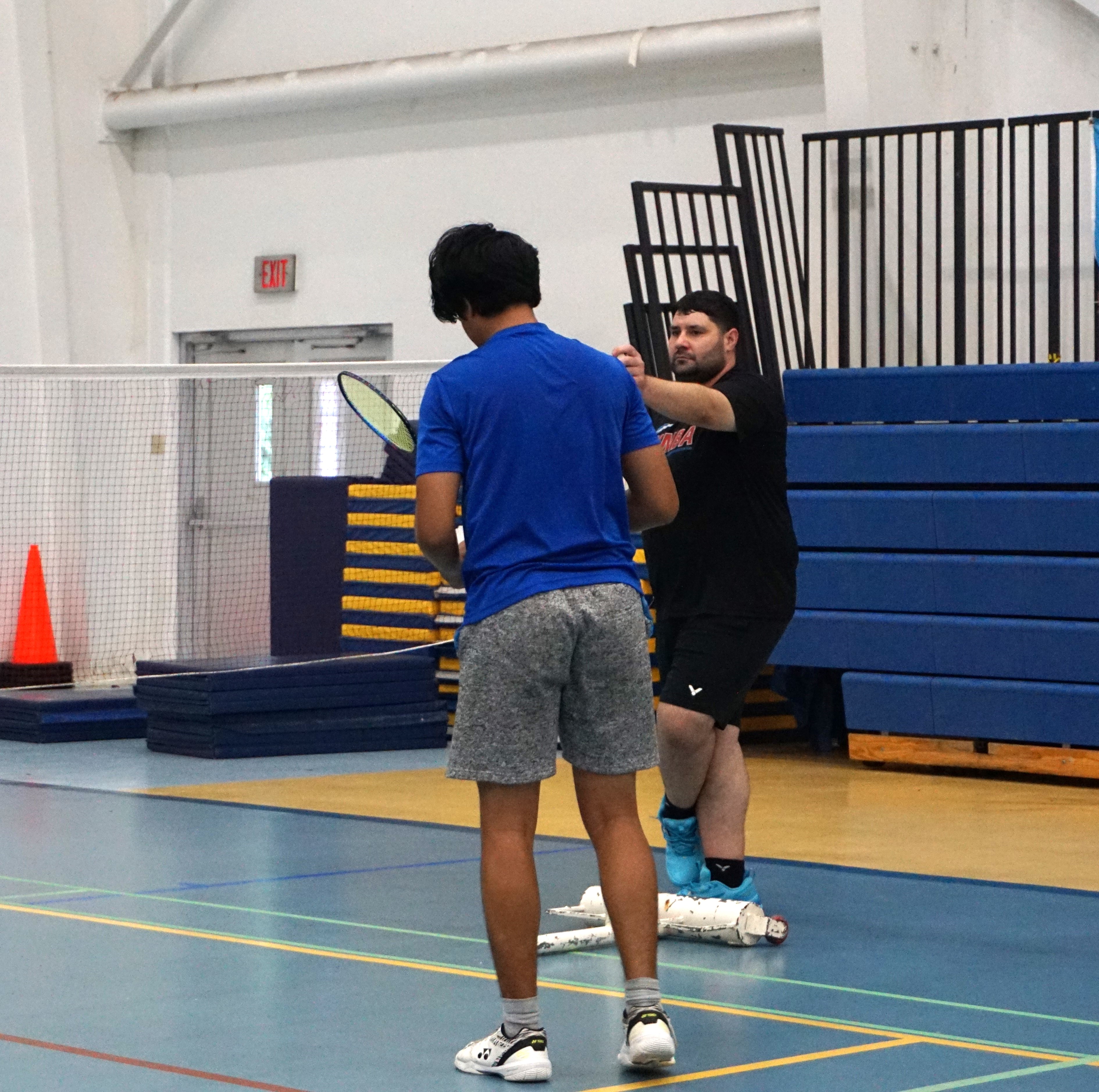 Robbie Thackam observes NMI players during his 3rd Badminton U19 Training Camp at the Marianas High School gym. 
