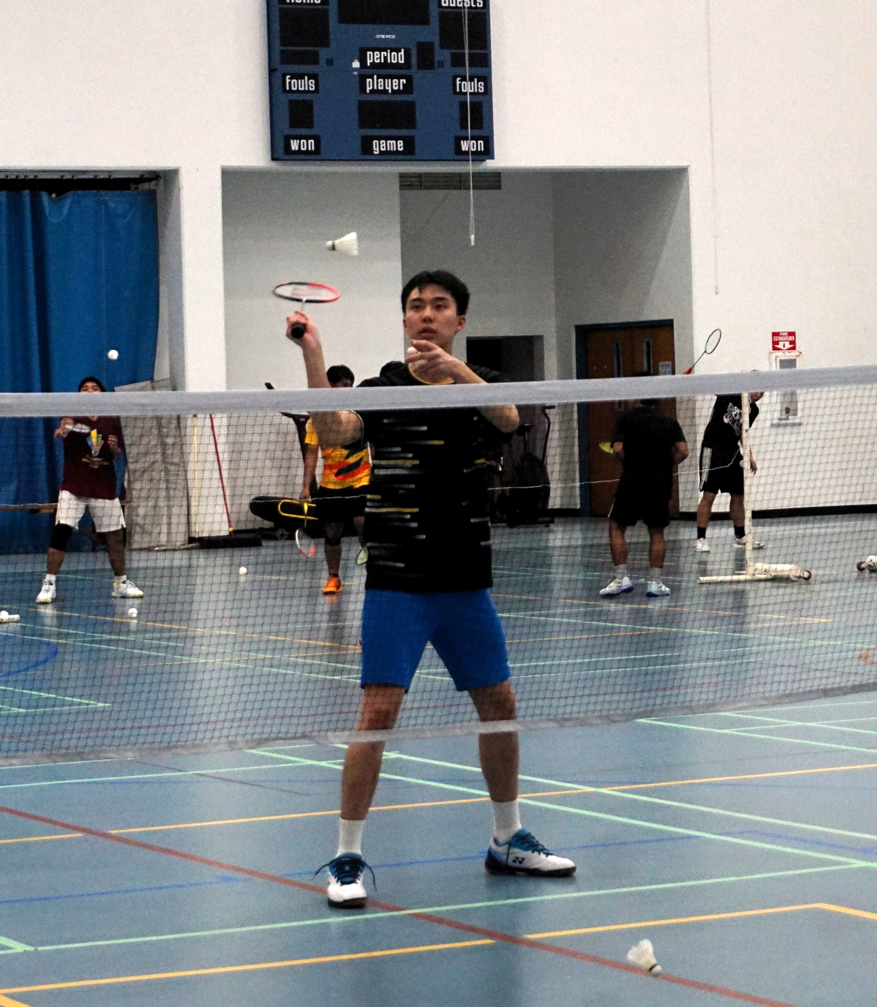 Edward Lau, currently ranked 155 in the world, practices with NMI players during Robbie Thackham's 3rd Badminton U19 Training Camp at the Marianas High School gym.