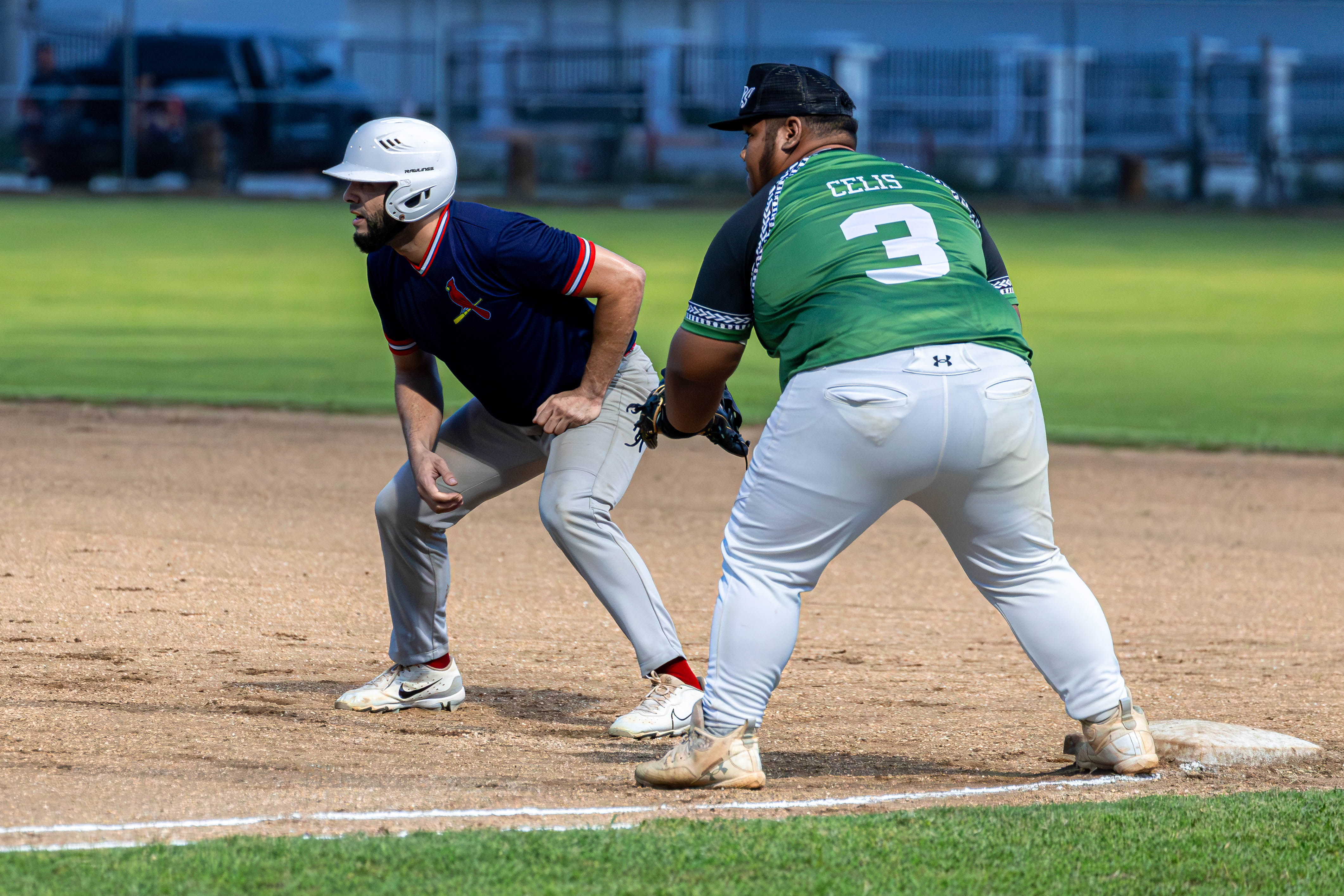 The Cardinals' Eli Augenbach sets up for the lead off to steal 2nd base.