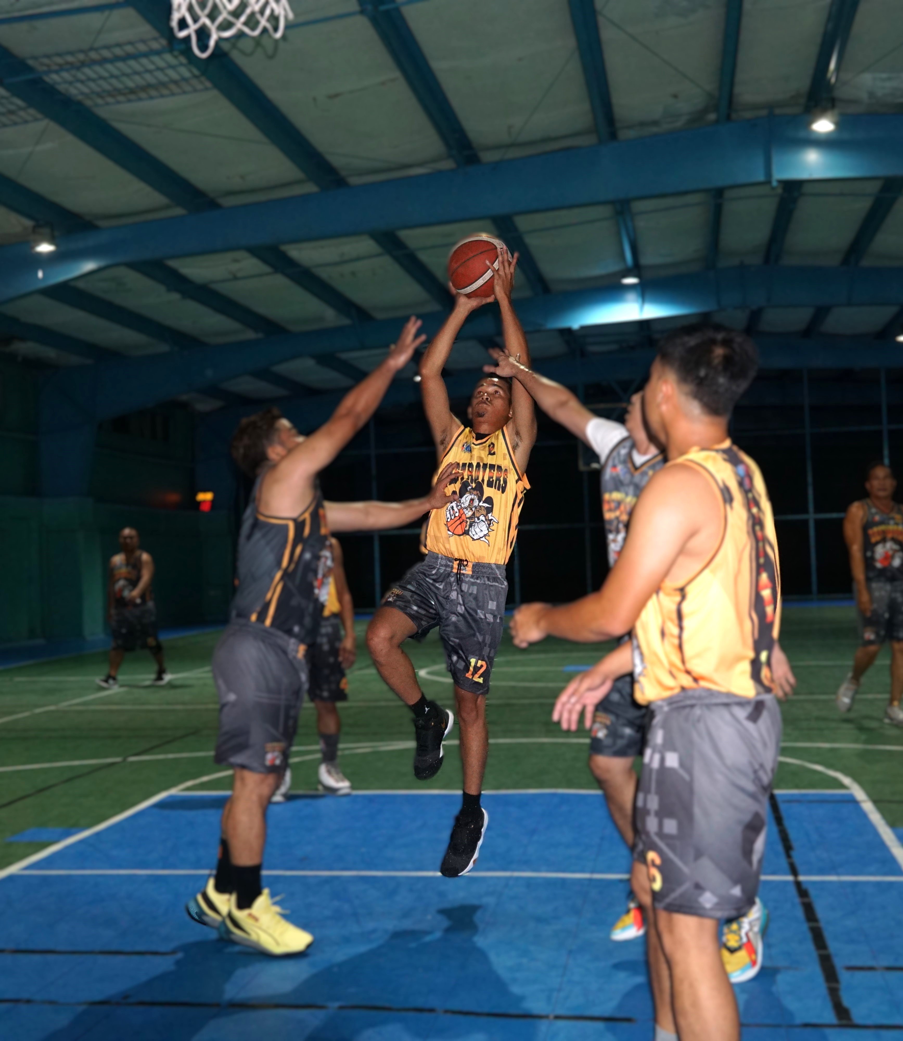Elite Force's Manuel Gatbonton rises up for a heavily contested shot against Bio-Pro in a basketball game of the 2024 Destroyers Friendly Games League at the TSL Sports Complex.
