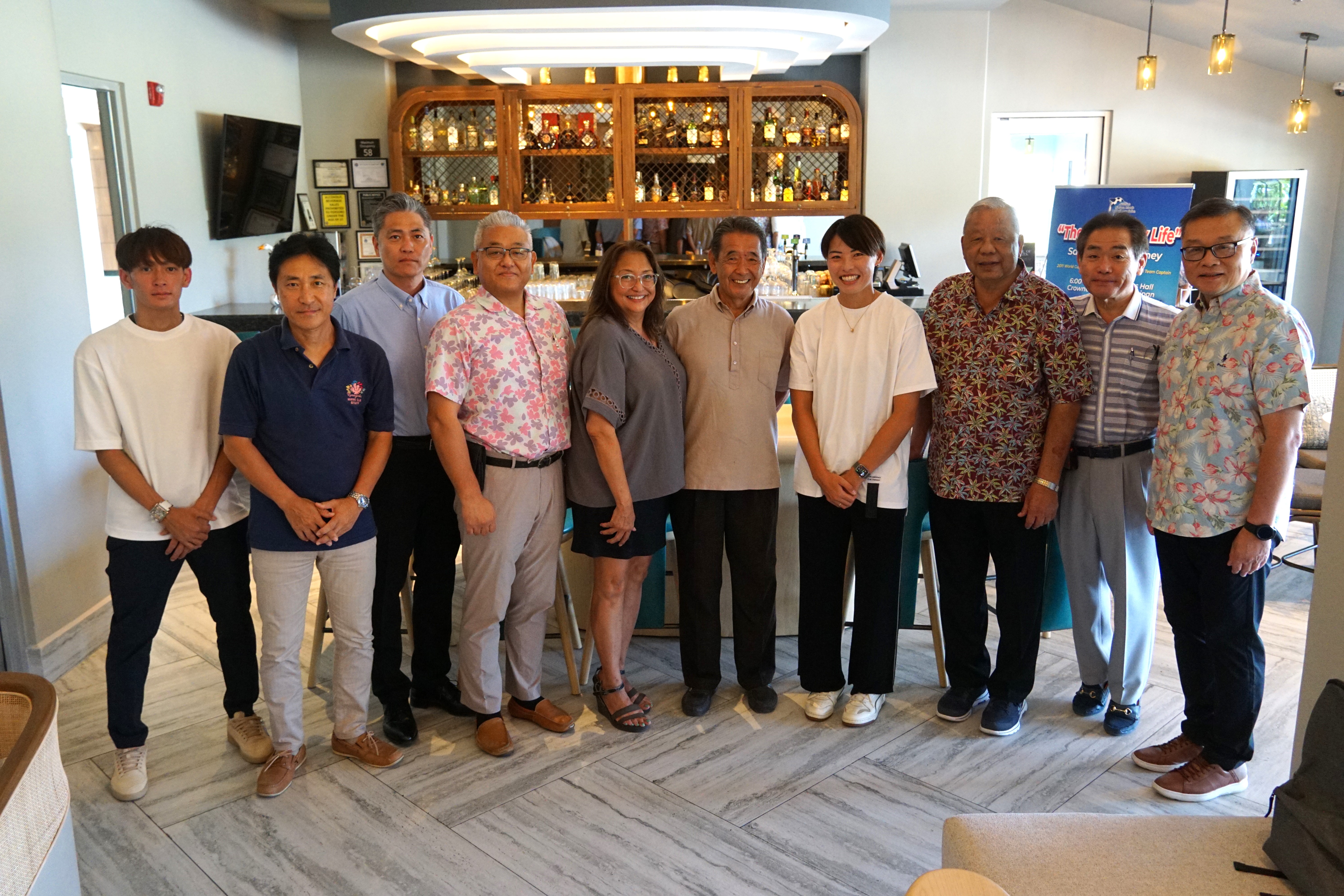 Saki Kumagai's manager Kouken Kuroki, Tasi Tour President Junichiro Takahashi, Japan Saipan Travel Association president Masaharu Takahashi, Tasi Tour General Manager and MVA board member Masaru Sunaga, MVA acting Chair Gloria Cavanaugh, Japanese Society of Northern Mariana Islands Chair Seiji Sato, Japanese soccer start Saki Kumagai, Lt. Gov David M. Apatang, PDM's Hideaki Sawada, and NMI Football Association President Jerry Tan pose for a photo at the Crowne Plaza Resort Saipan on Friday.
