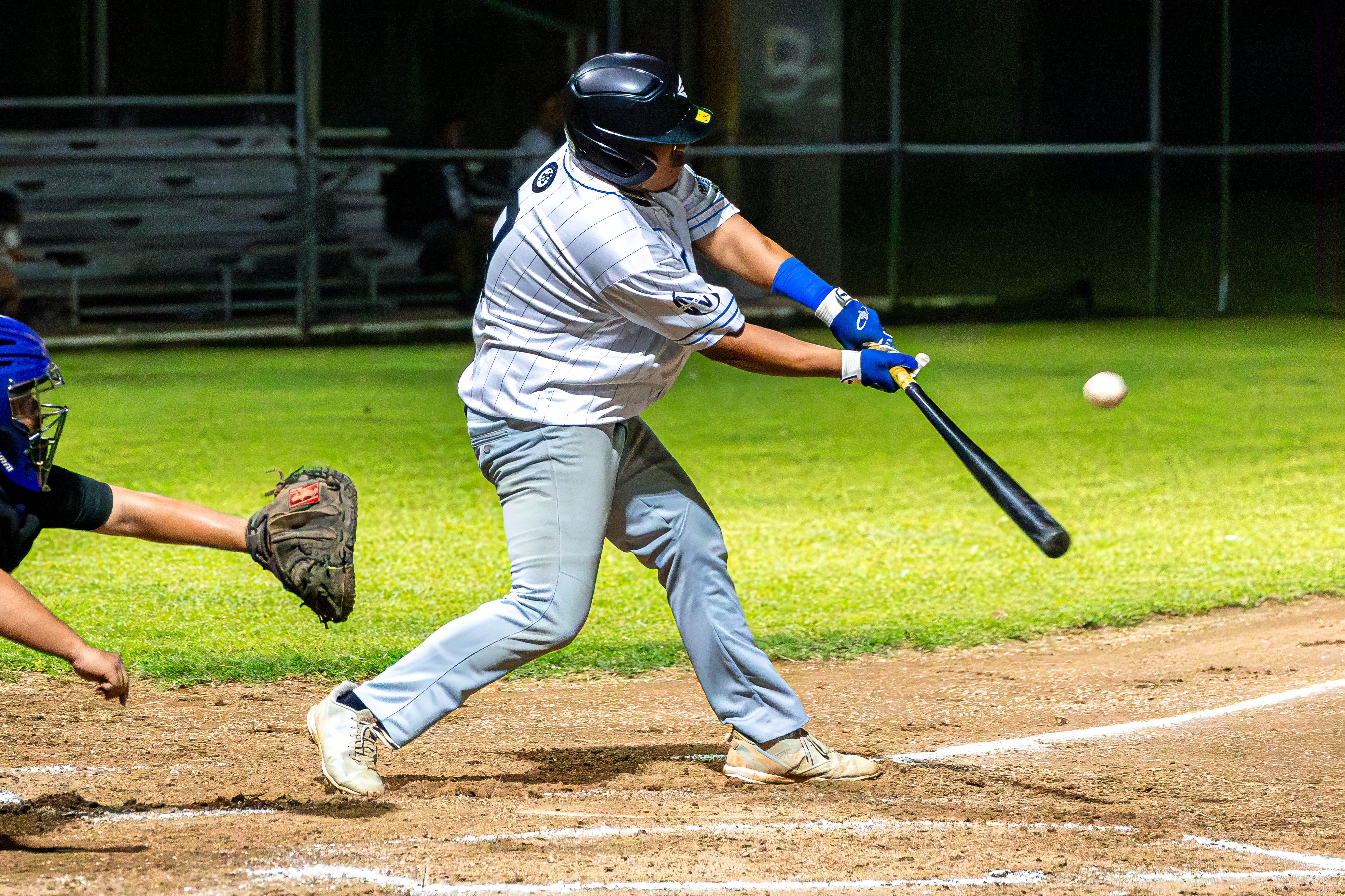 With the bases loaded, the Falcons’ Ian Norita connects a double to bring in two runners during a game against the Blue Shark in the 2024 Tan Holdings Saipan Baseball League at the Francisco "Tan Ko" Palacios Baseball Field.