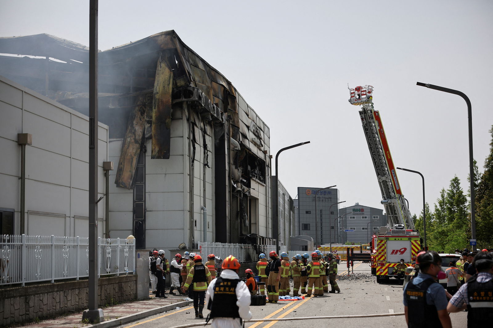 Emergency personnel work at the site of a deadly fire at a lithium battery factory owned by South Korean battery maker Aricell, in Hwaseong, South Korea, June 24, 2024.