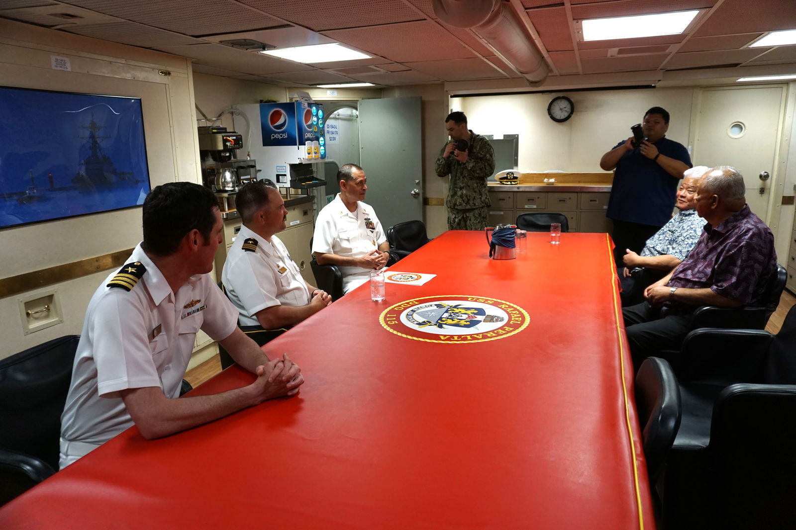 Gov. Arnold I. Palacios and Lt. Gov. David M. Apatang meet with the officers USS Rafael Peralta before taking a tour of the ship. 