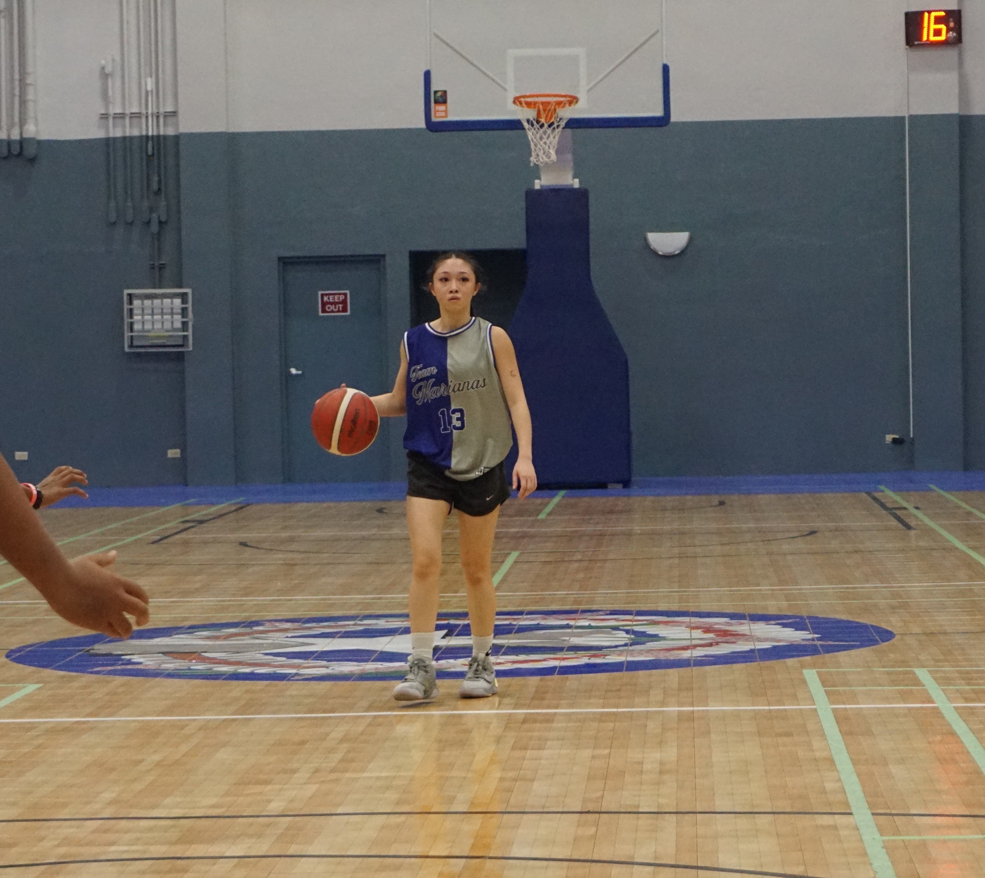 Team Marianas' Kaia Travilla brings the ball past half court during a game in the Pokka Cup 2024 at the Ada gym.