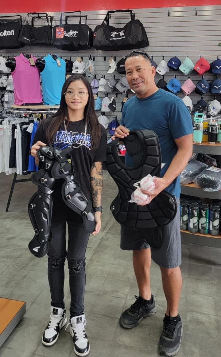 April Tumada of Borderline/Allstar Sporting Goods is pictured with Chairman Joseph E. Santos of the 19th Tinian Municipal Council.