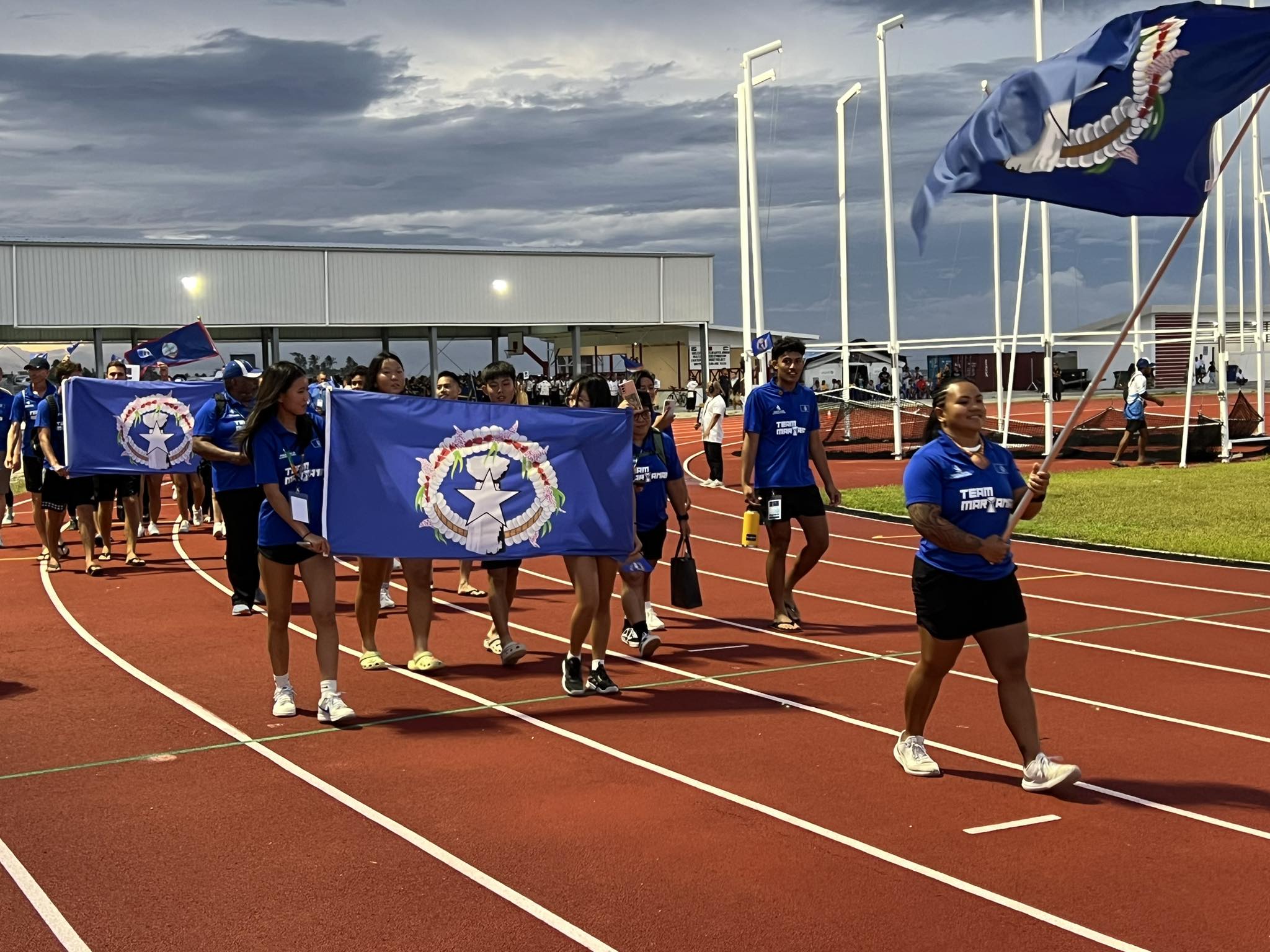 Team CNMI parades along the newly opened track field during the opening ceremony for the 10th Micronesian Games in Majuro Saturday, June 15.