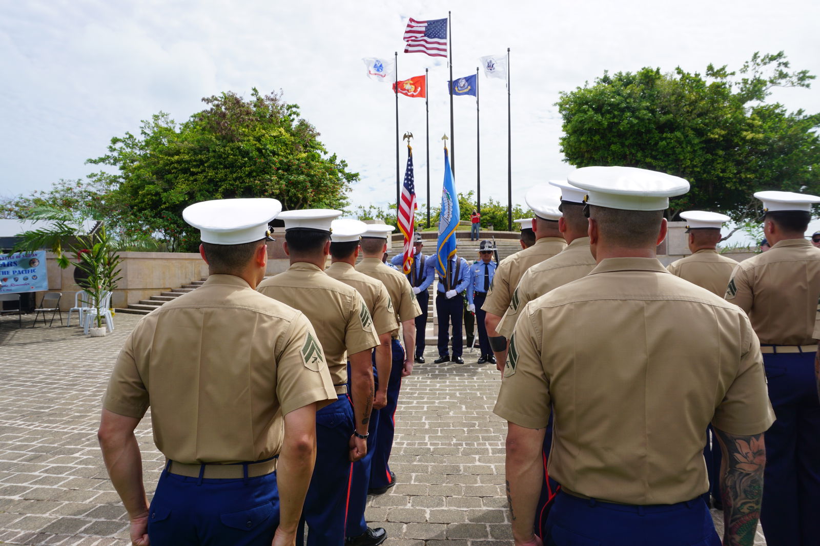 U.S. Marines stand at attention as CNMI Department of Public Safety officers post the colors at American Memorial Park’s Court of Honor.