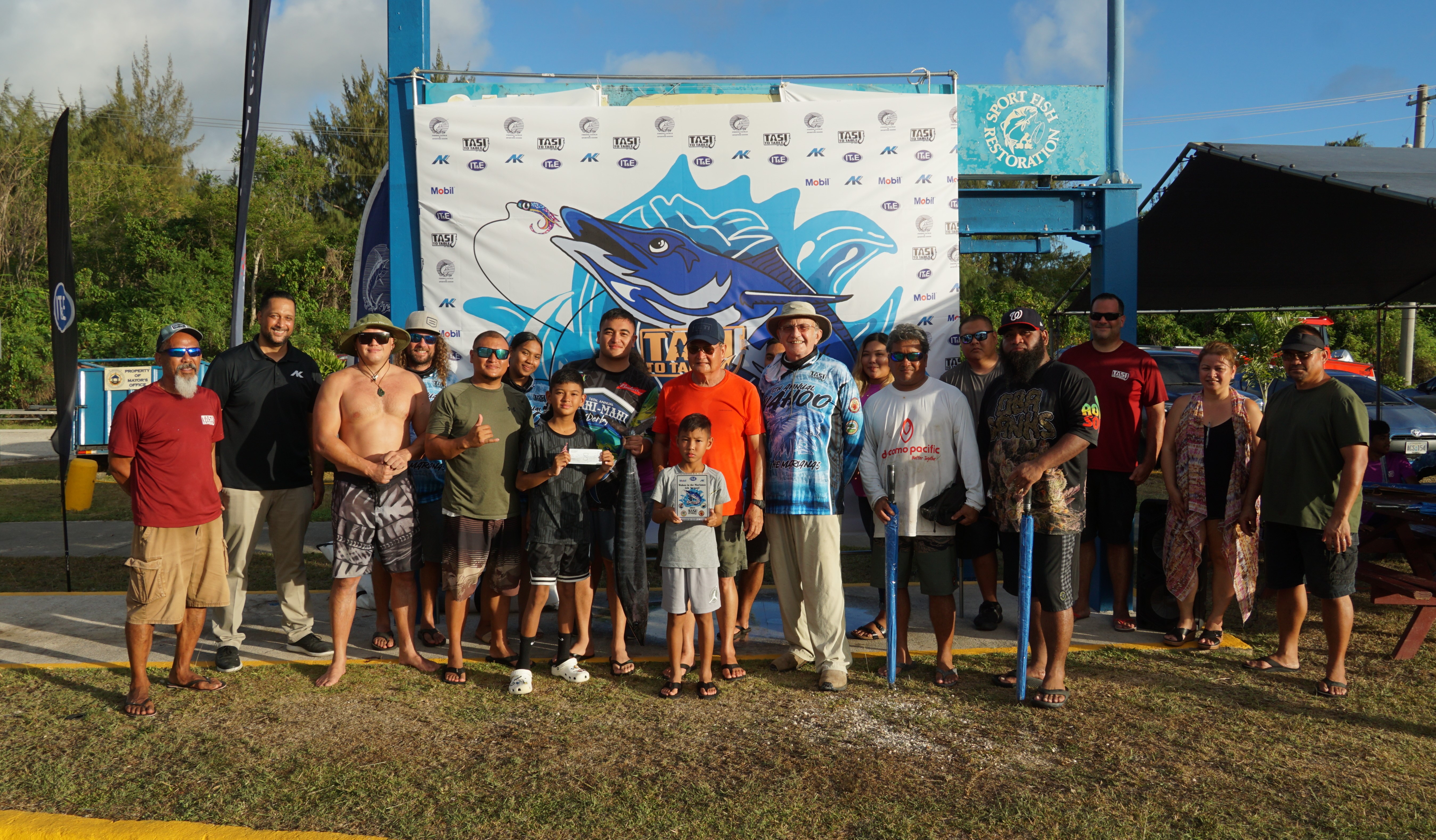 MV Gloria’s captain and crewmembers pose with the second-place trophy and Tasi To Table officials during the awards ceremony of Tasi To Table's 5th Annual Wahoo in the Marianas at the Smiling Cove Marina on Saturday.