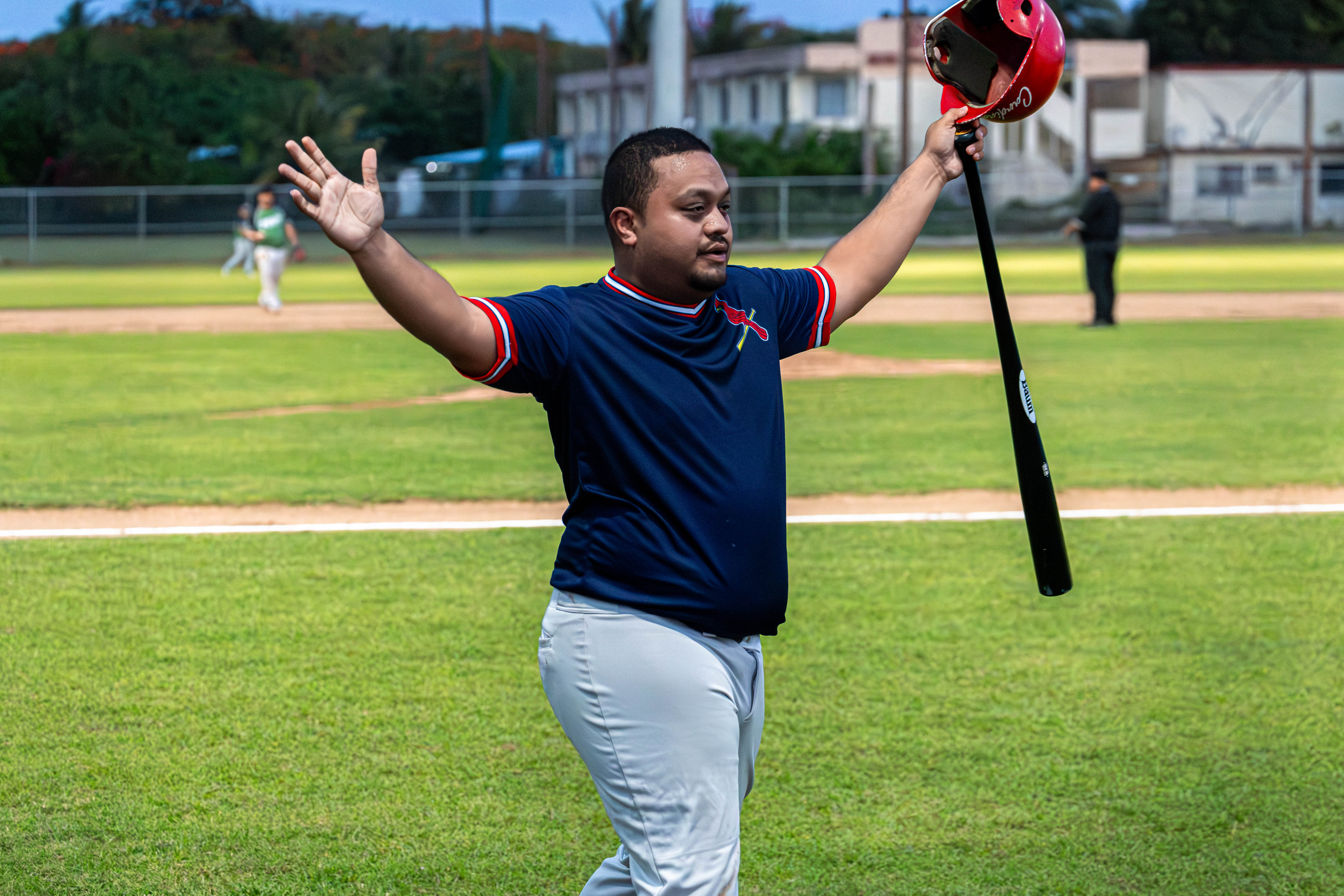 The Cardinals' Keoni Kaipat celebrates after scoring another run for his team during a game against D9er's in the 2024 Tan Holdings Saipan Baseball League at the Francisco "Tan Ko" Palacios Baseball Field. 
