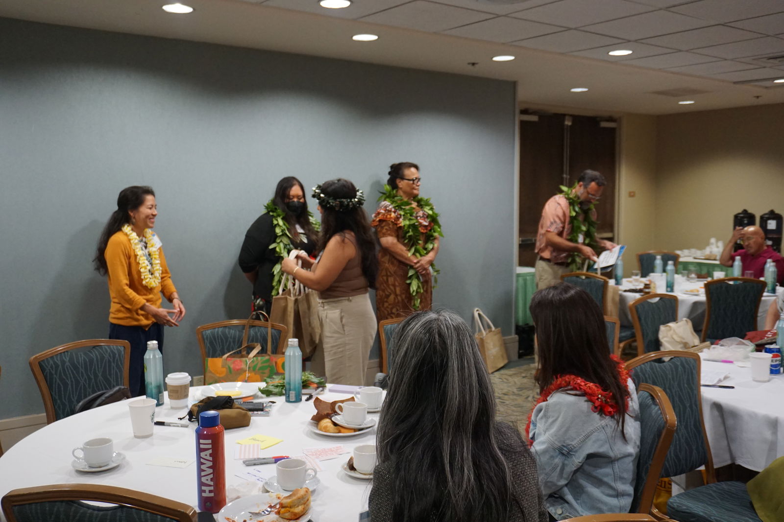 Naomi Tudela, program manager at the Northern Marianas Humanities Council, presents the CNMI's gifts to the other members of the Pacific Island Humanities Network.