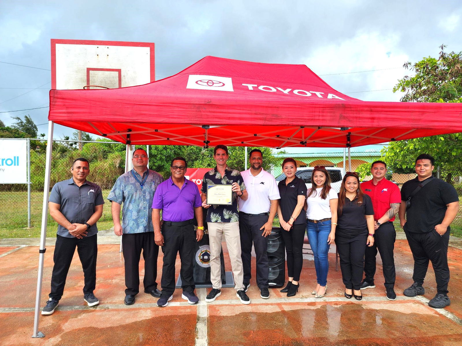 Saipan Mayor Ramon “RB” Camacho joins Atkins Kroll General Manager Clark Boswell and his staffers for a souvenir photo at the Capital Hill basketball court, which AK has “adopted.” Also in photo: House Speaker Edmund Villagomez.