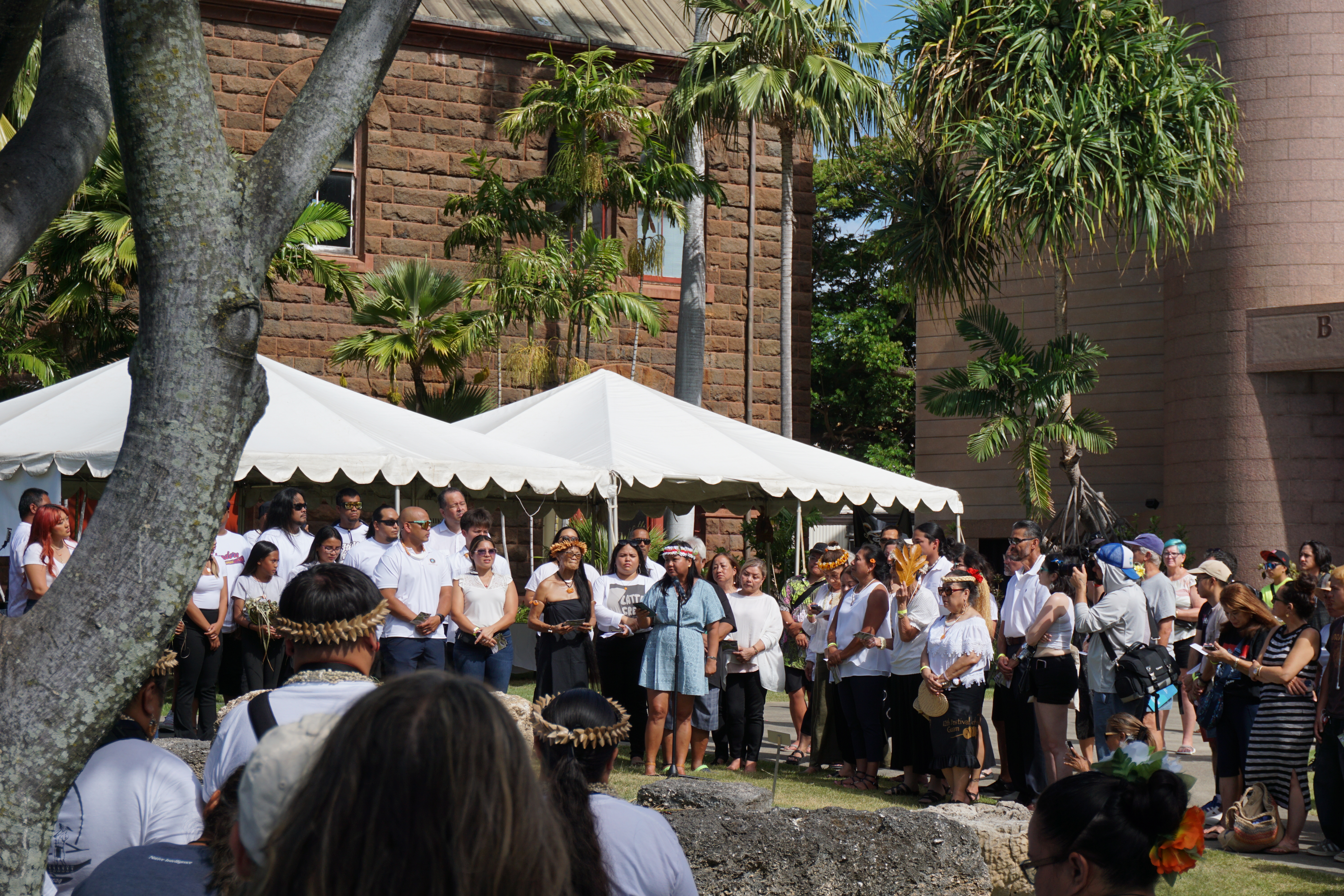 Joeten-Kiyu Public Library Director Erlinda Naputi speaks in Chamorro at the ceremony.