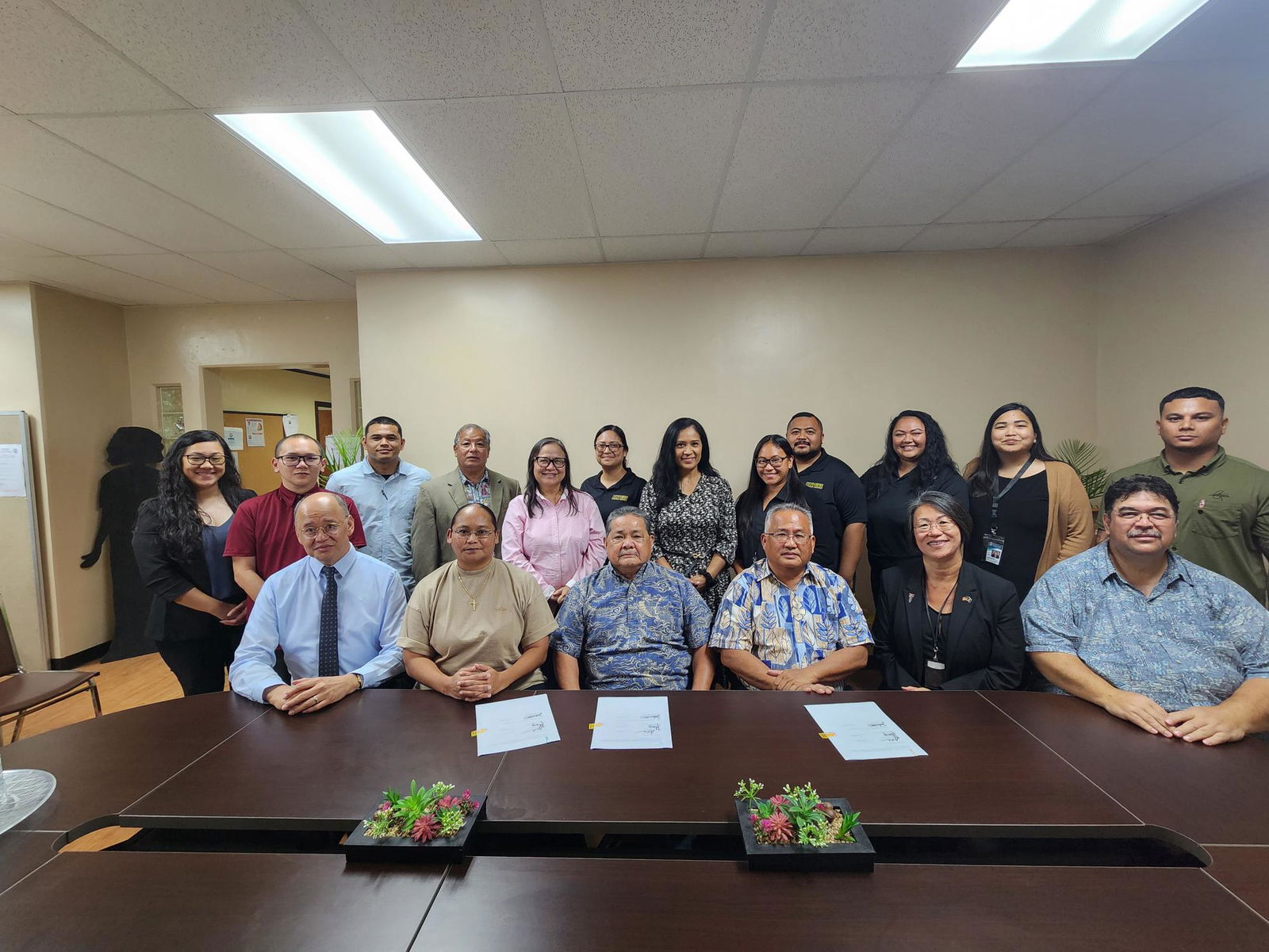 CNMI justices and judges, Office of Adult Probation and Northern Marianas Technical Institute officials pose for a group photo after the signing of an MOU that will provide technical training to local probationers.