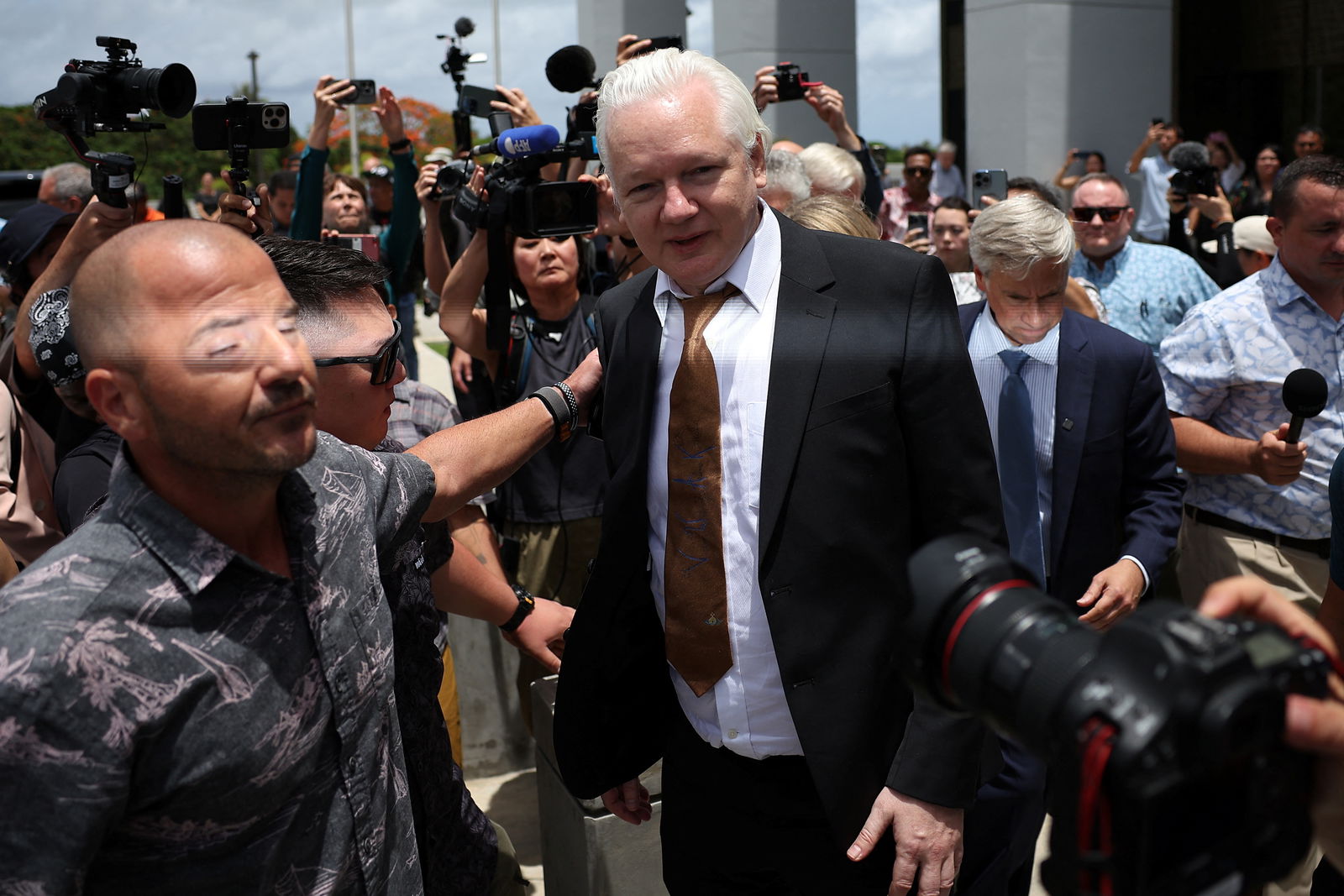 WikiLeaks founder Julian Assange walks outside United States District Court following a hearing, in Saipan, Northern Mariana Islands, June 26, 2024. 