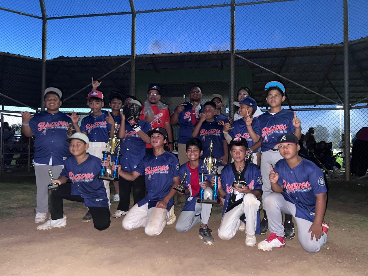 The Braves pose for a photo after winning the majors division title of the 2024 Natibu Sports Association Youth Baseball League at the Miguel "Tan Ge" Pangelinan Baseball Field on Sunday, June 16.