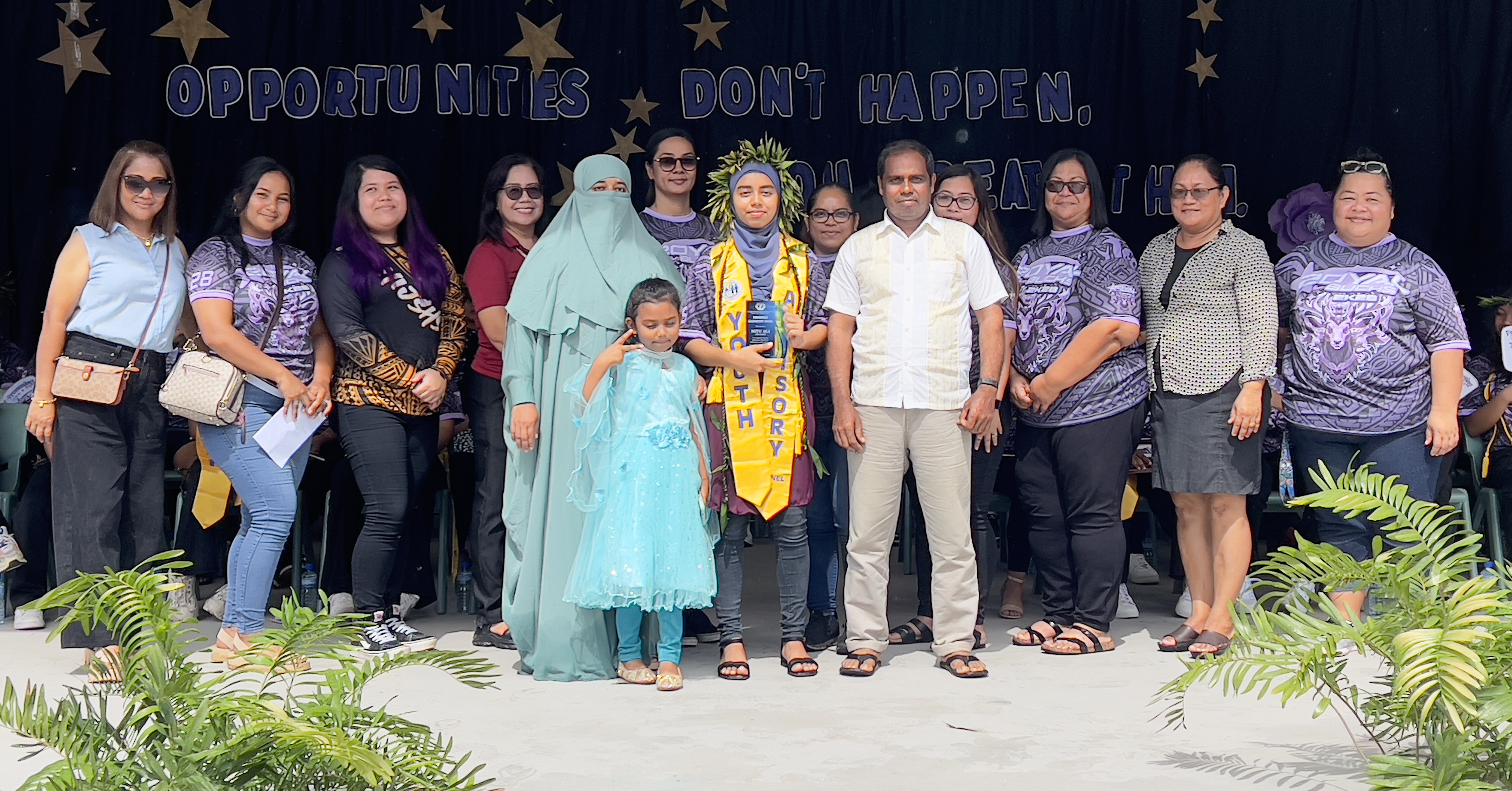 Principal Annette Calvo, second right, presents the Principal Leadership Award to Nitu Ali.  Calvo, the school’s long time vice principal, was named the school administrator early this year. Also in photo are RHI’s middle school teachers.