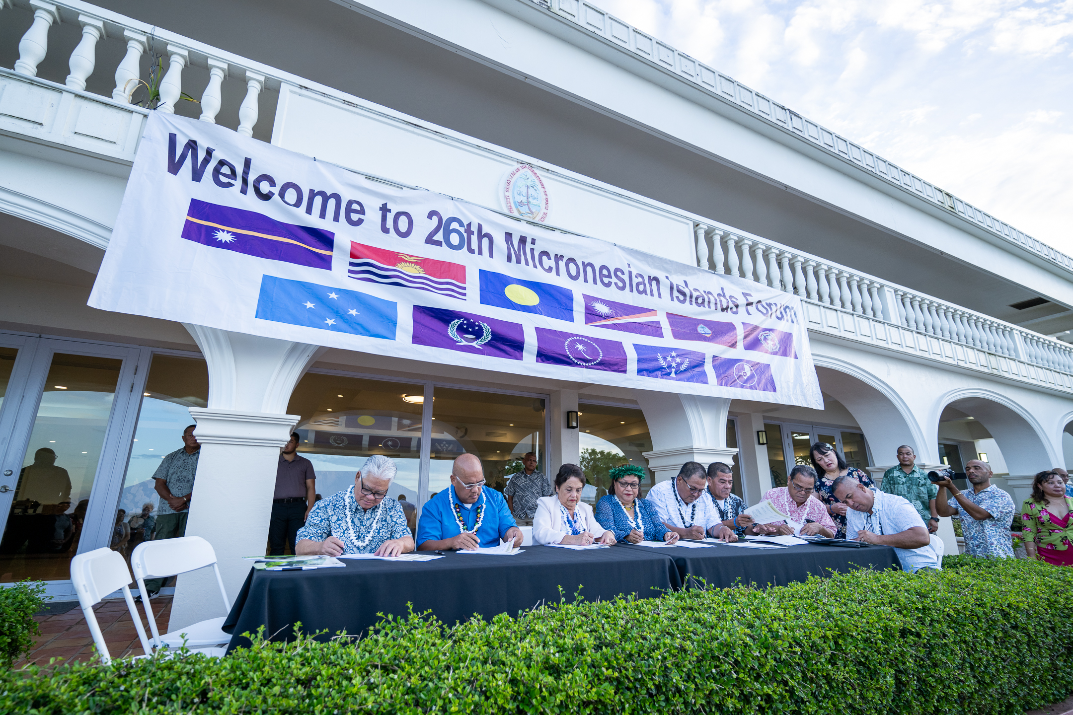 Leaders of Micronesian island nations and territories sign a joint communiqué on Wednesday at the conclusion of the 26th Micronesian Islands Forum hosted by Guam.