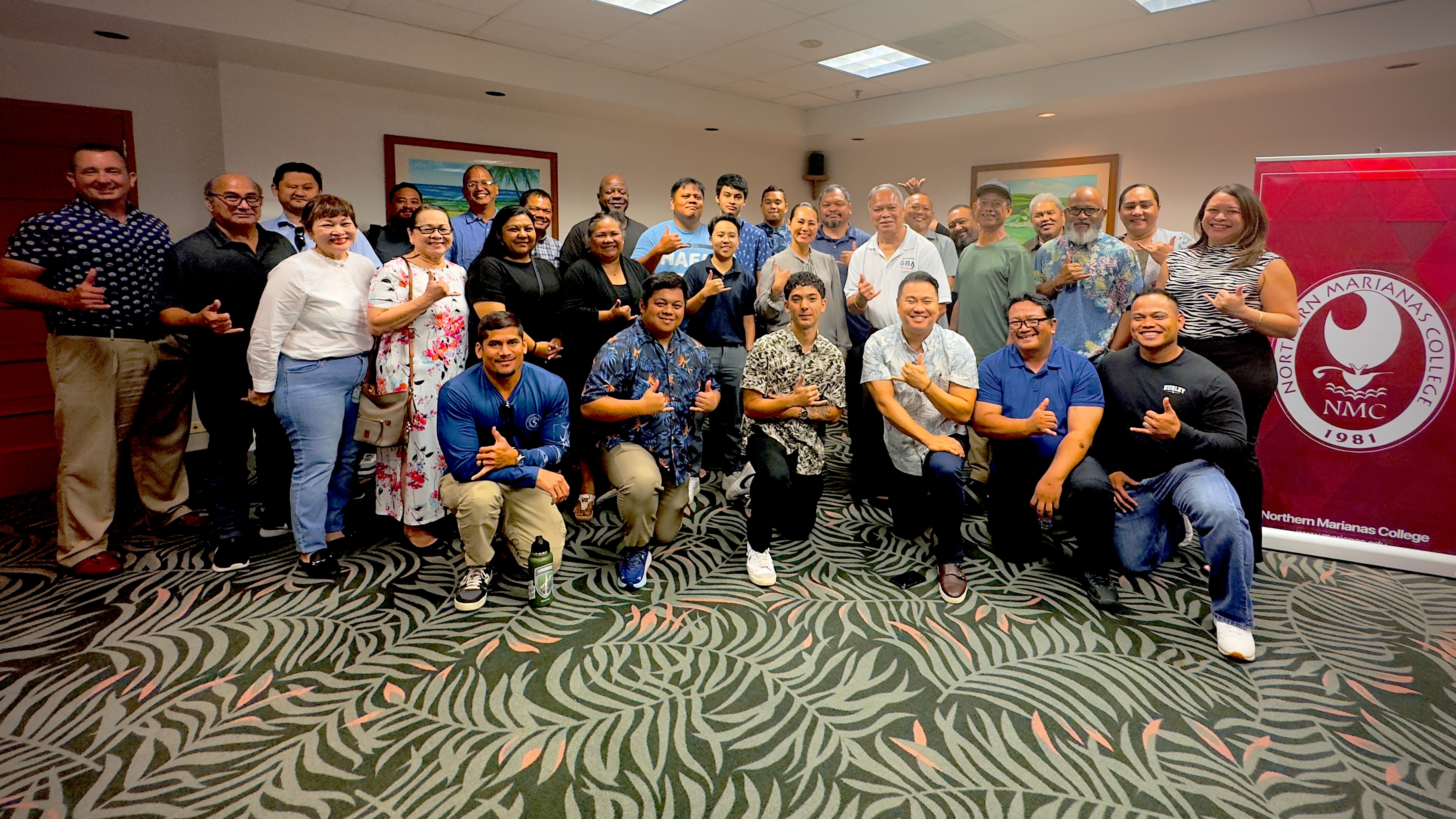 U.S. Small Business Administration's Guam Branch Manager Ken Lujan, Veterans Business Outreach Center of the Pacific's Director Dennis Kwak and CNMI SBDC's Network Director Nadine C. Deleon Guerrero pose for a group photo with the Boots to Business training event participants.