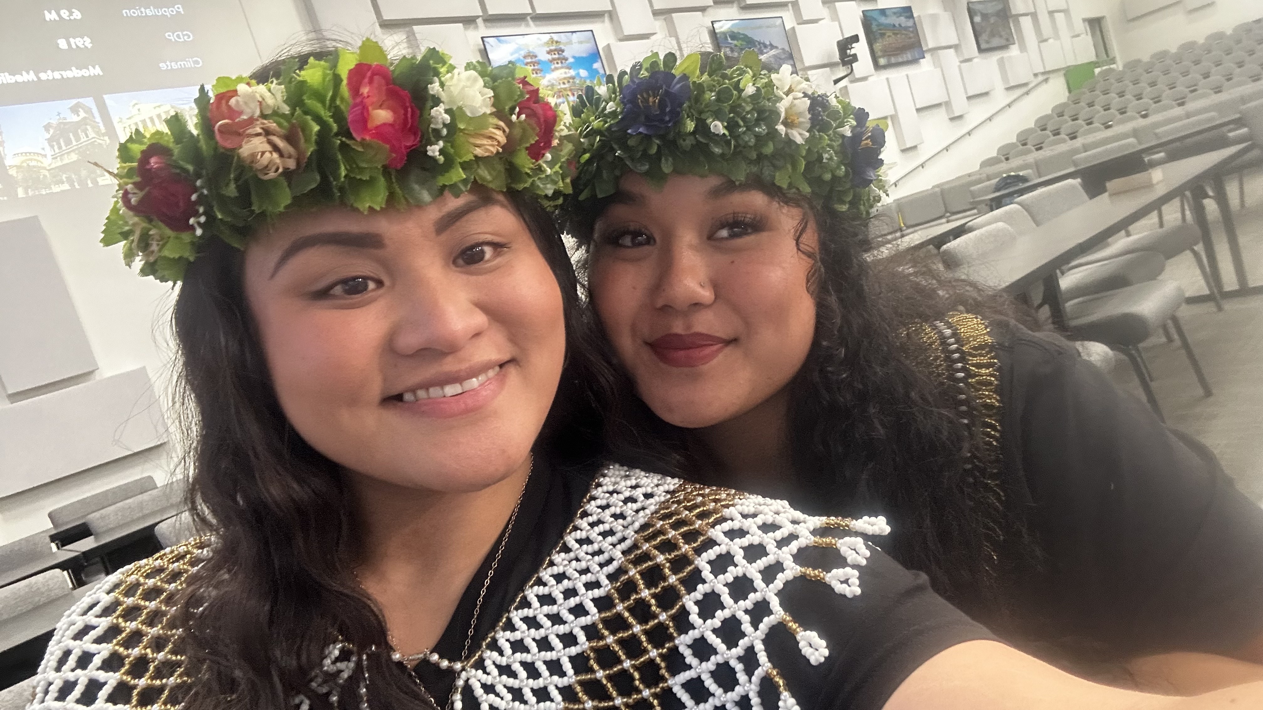 Juanette “Nette” Villagomez and Leischeng “Lei” Saures pose for  a photo before performing at Walmart’s home office.