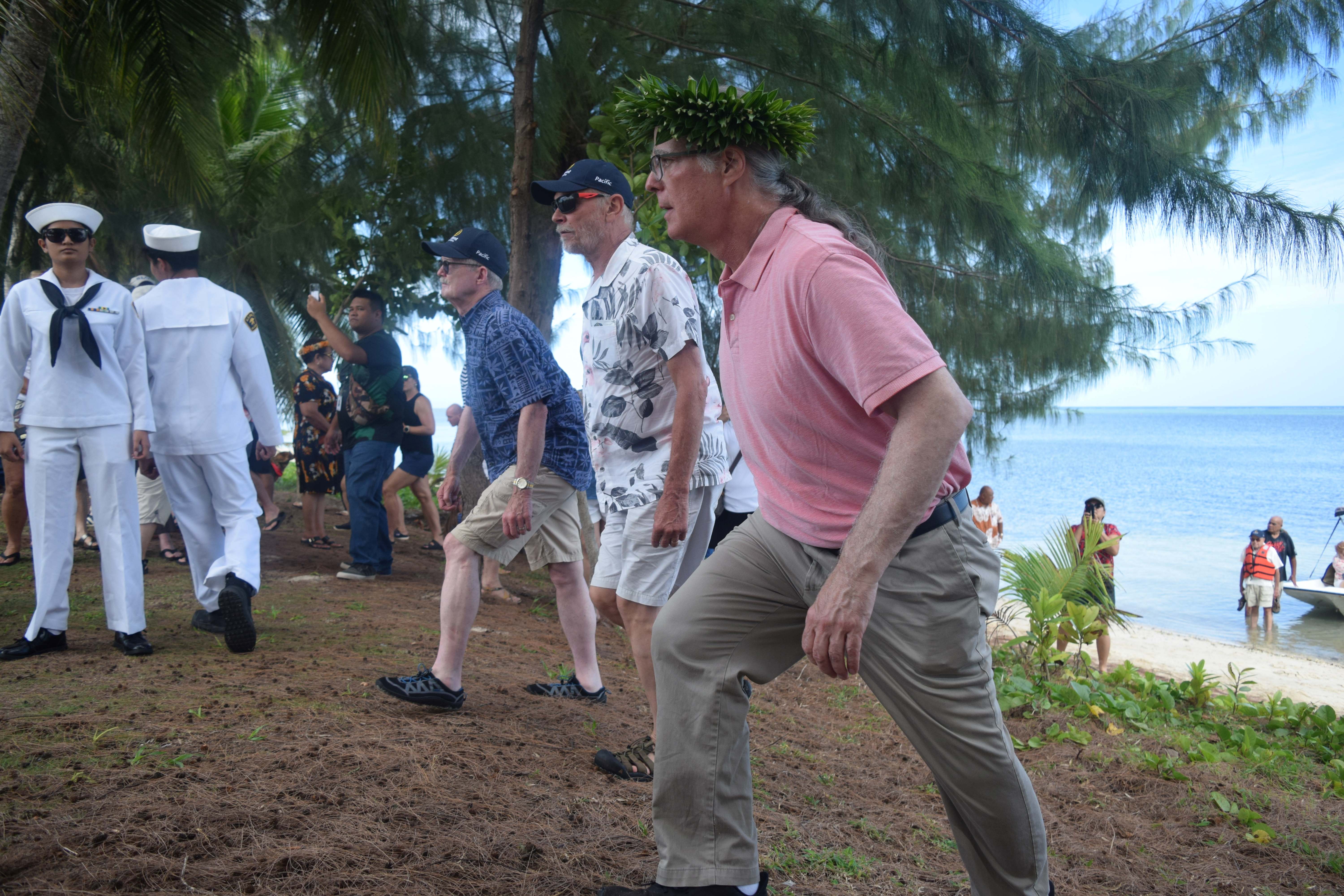 Jack Padley, Dave Knisley and William Michels Jr. reenact the landing of  their fathers and other American servicemembers on Invasion Beach on June 15, 1944 at what is now known as the Civic Center in Susupe during the commemoration of the 80th anniversary of the Battle of Saipan on Saturday, June 15, 2024.
