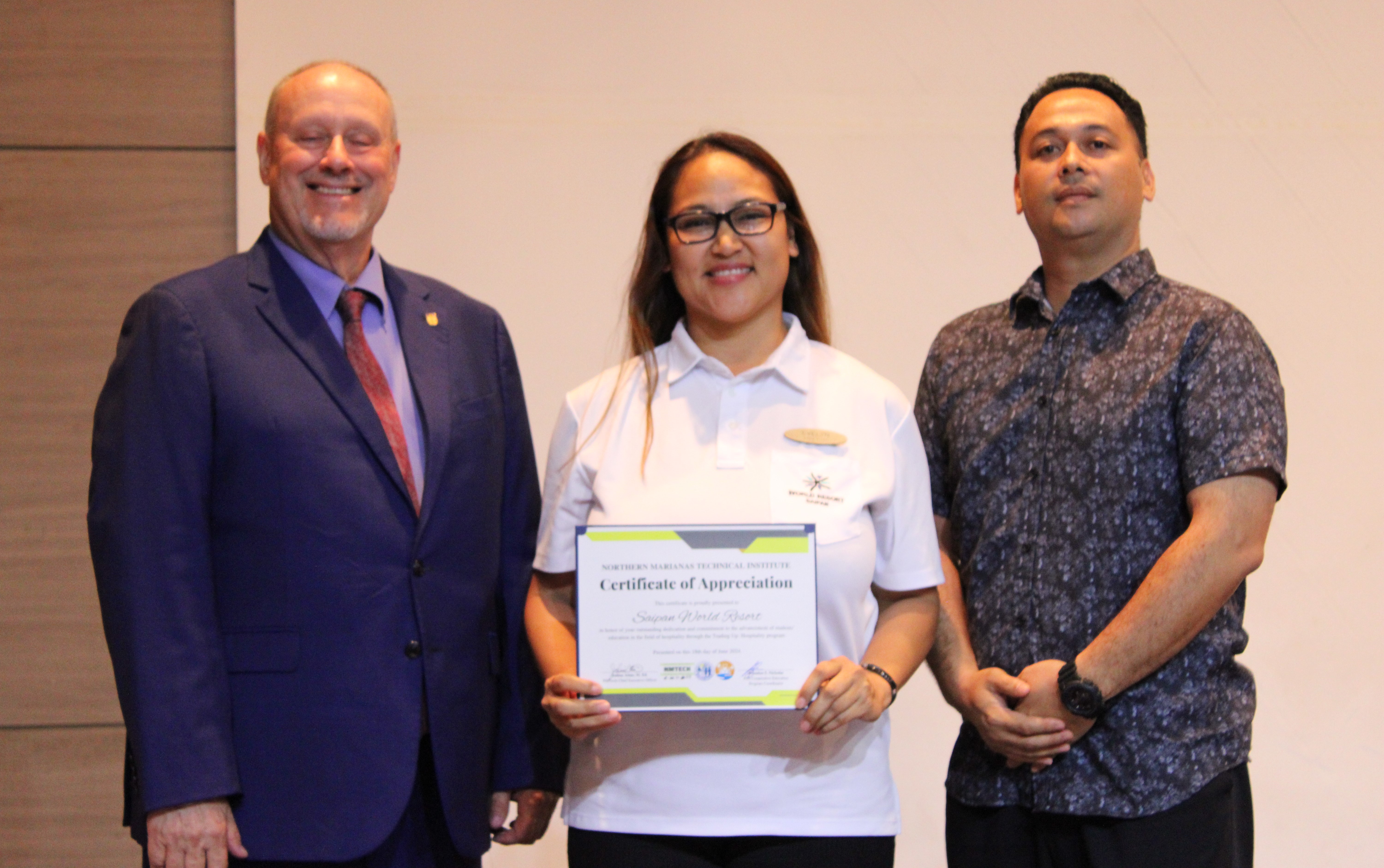 AHLEI licensee for the NMI Jim Arenovski and Zen Tomokane, along with the NMTech board of directors, present Saipan World Resort with a certification of appreciation for hosting students in the hospitality job experience program.  Not pictured are the other hosts: Kensington, PIC and Surf Rider hotels.