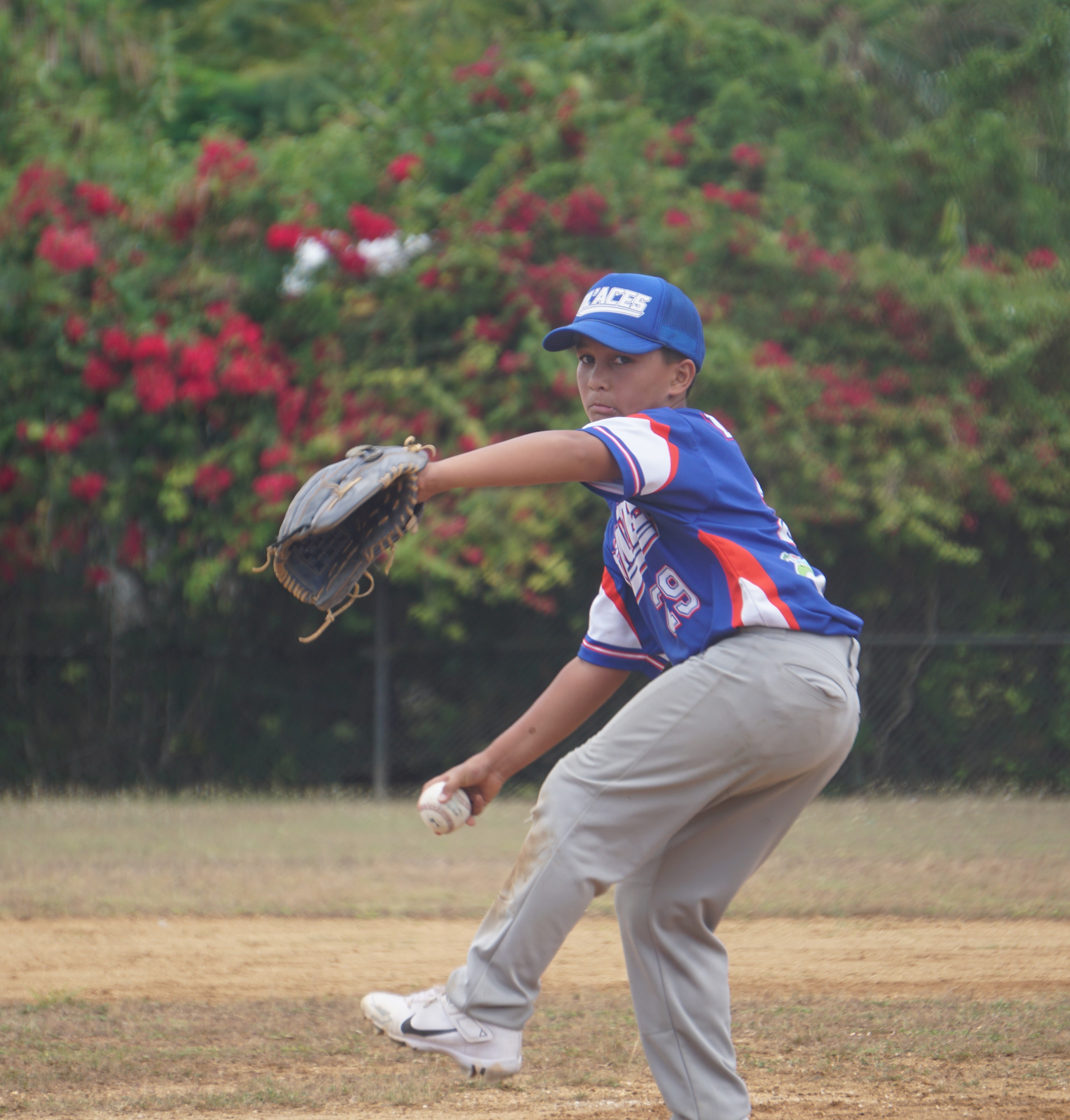 The Ol'Aces' Liam Sablan pitches against the Pirates during a game in the majors division of the 2024 NSA Youth Baseball League at the Miguel "Tan Ge" Pangelinan Baseball Field.
