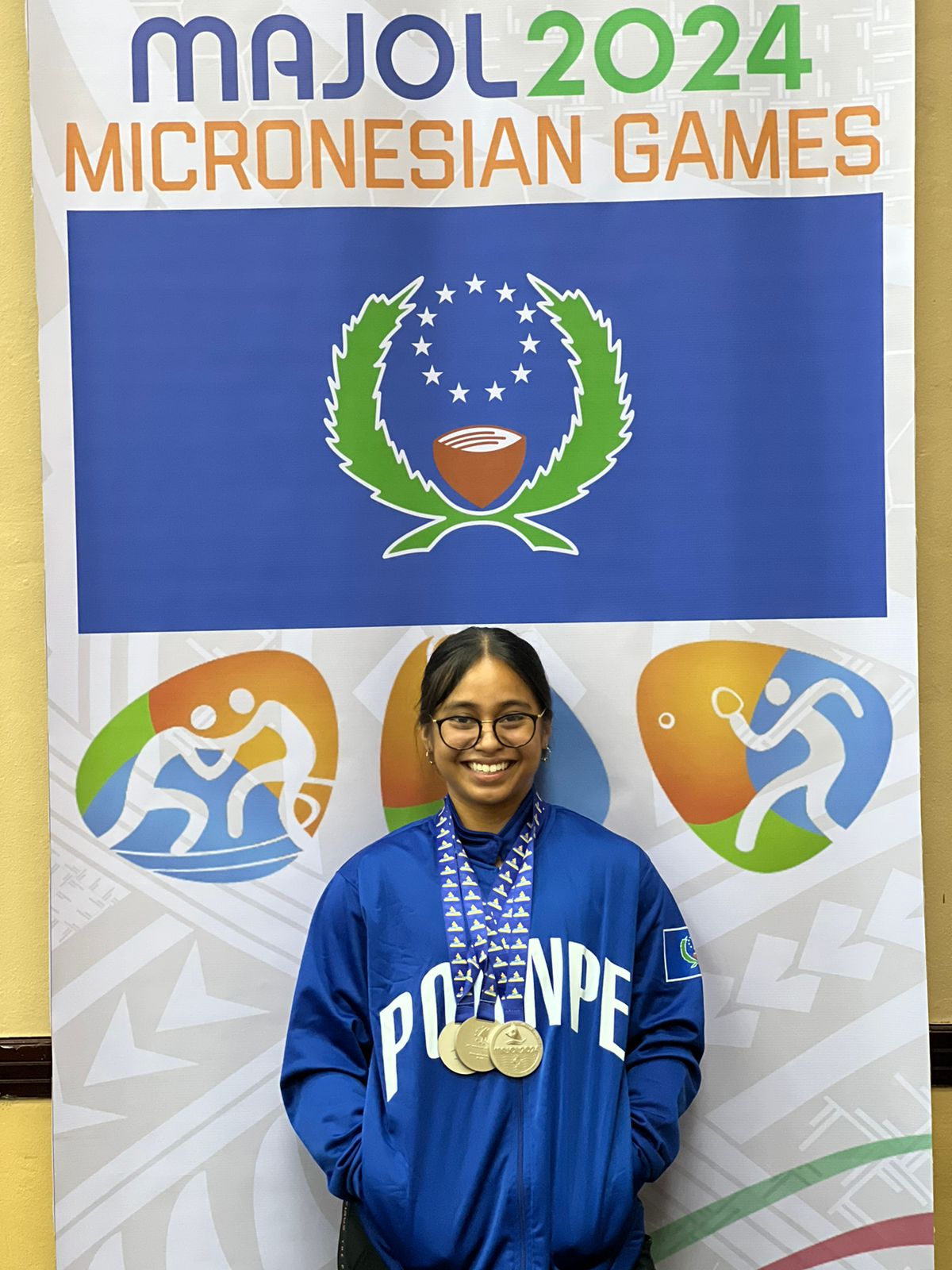 Cheyanne Manuel, representing Pohnpei, poses with the three silver medals in weightlifting she won at the 2024 Micronesian Games in Majuro, the Marshall Islands on Tuesday.