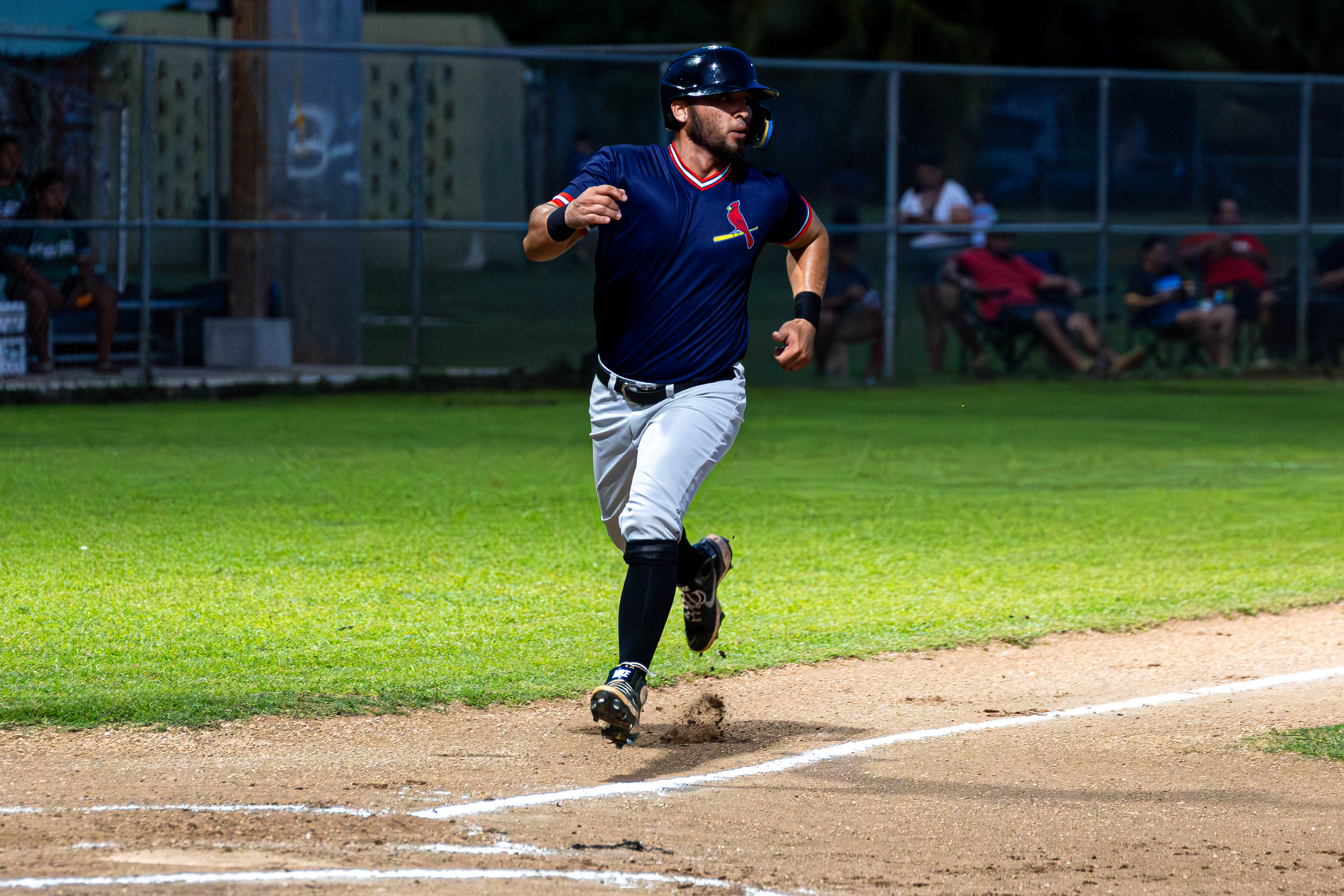 The Cardinals' #52 Tenorio runs in and scores for his team.
