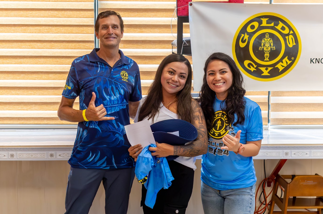 General Manager Tyce Mister, left and Assistant Manager Michelle Masga, right, congratulate overall female winner, Leilani Deleon Guerrero, center.