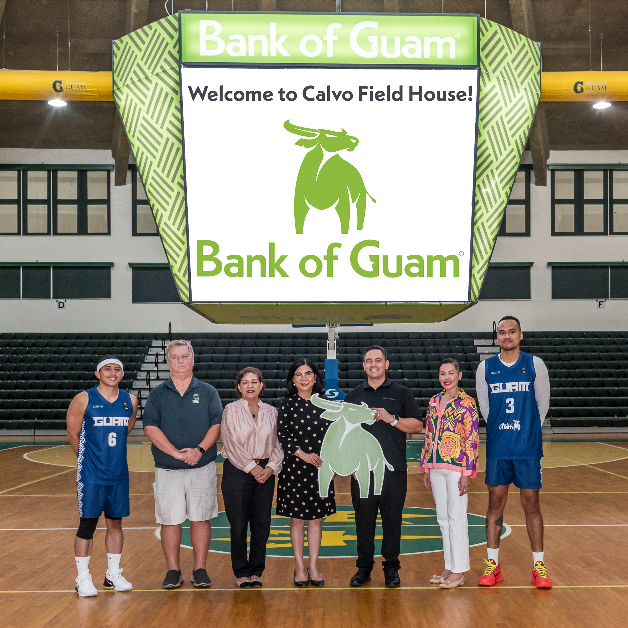 From left, Aljurrell Grape, player, Bank of Guam Men’s National Basketball Team; Douglas W. Palmer, athletic director, University of Guam; Dr. Gena Rojas, interim dean, Enrollment Management and Student Success, University of Guam; Dr. Anita Borja Enriquez, president, University of Guam;   Joaquin P. L.G. Cook, president and chief executive officer, Bank of Guam;   Lesley Leon Guerrero, senior  vice  president,  chief  experience  officer,  Bank  of Guam and vice chair for the University of Guam Board of Regents; and Mark Johnson, player, Bank of Guam Men’s National Basketball Team.