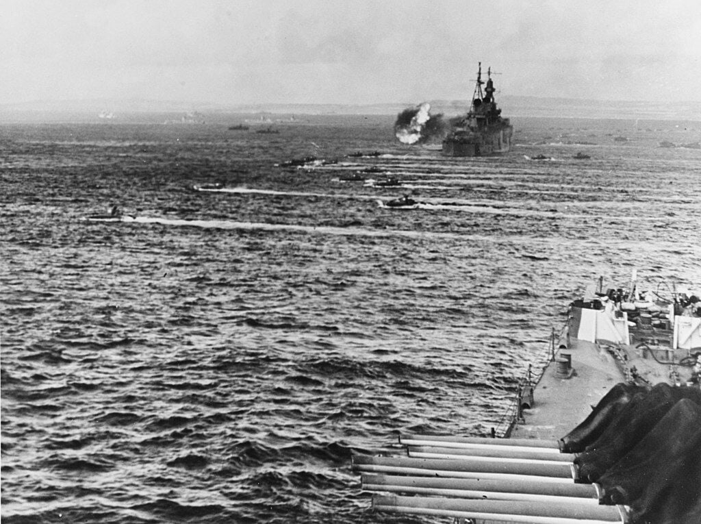 LVTs move toward Saipan, past bombarding cruisers on June 15, 1944.