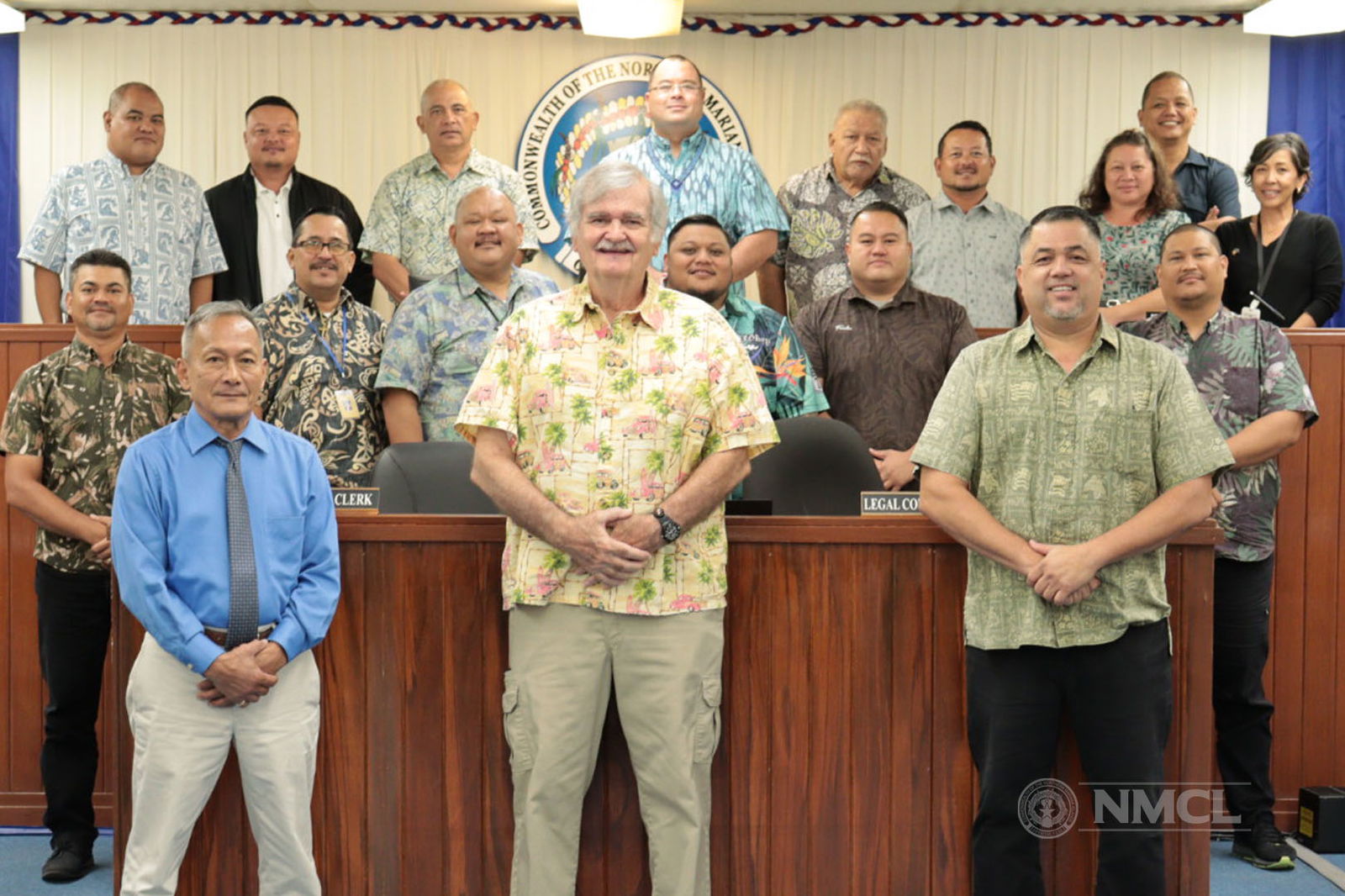 Commonwealth Public Utilities Commissioner Dr. John “Jack” Angello poses for a photo with House members shortly after they confirmed his re-appointment.