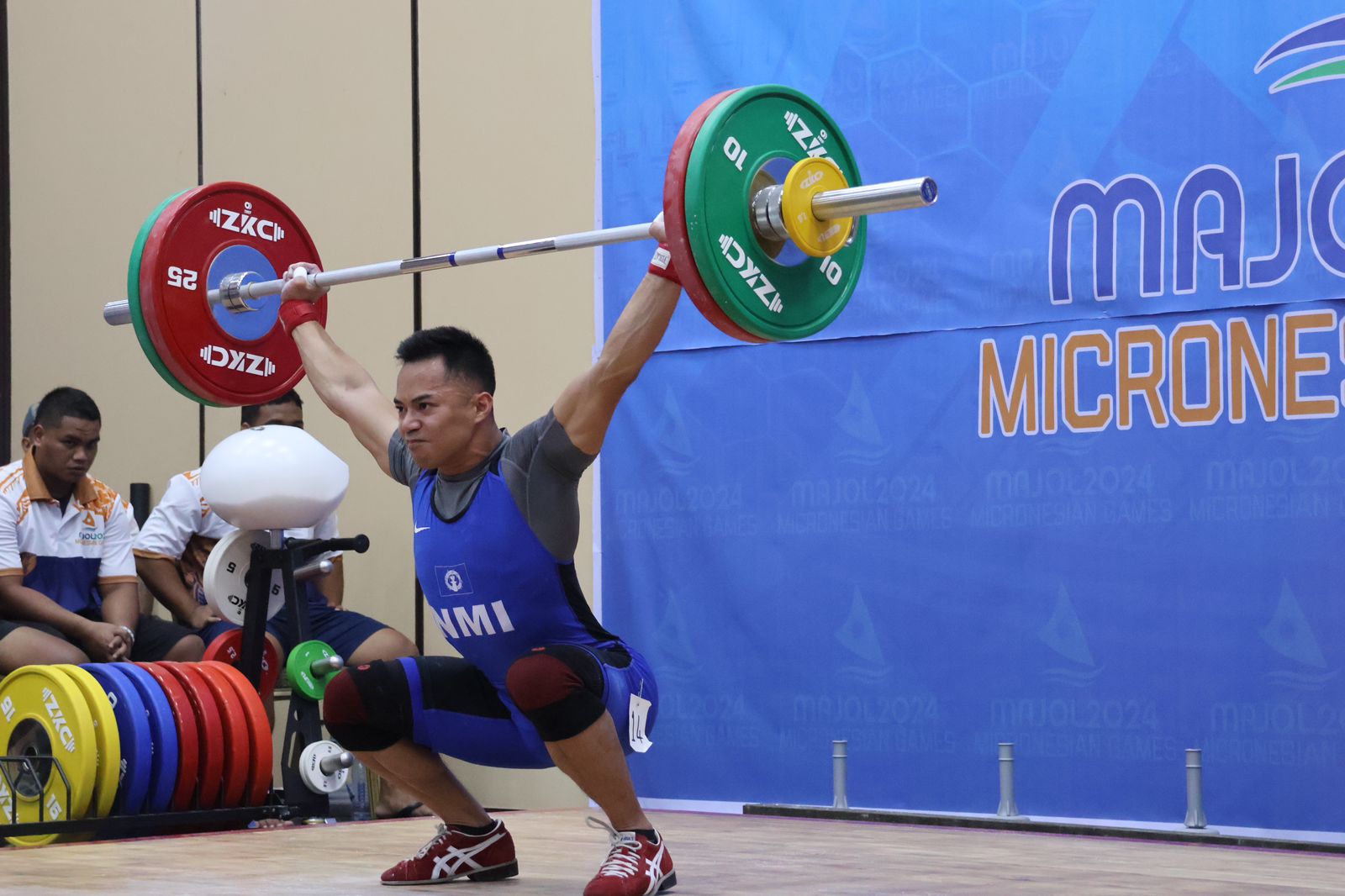 The NMI’s Leowell Cristobal competes in the 67kg class in the weightlifting competition.