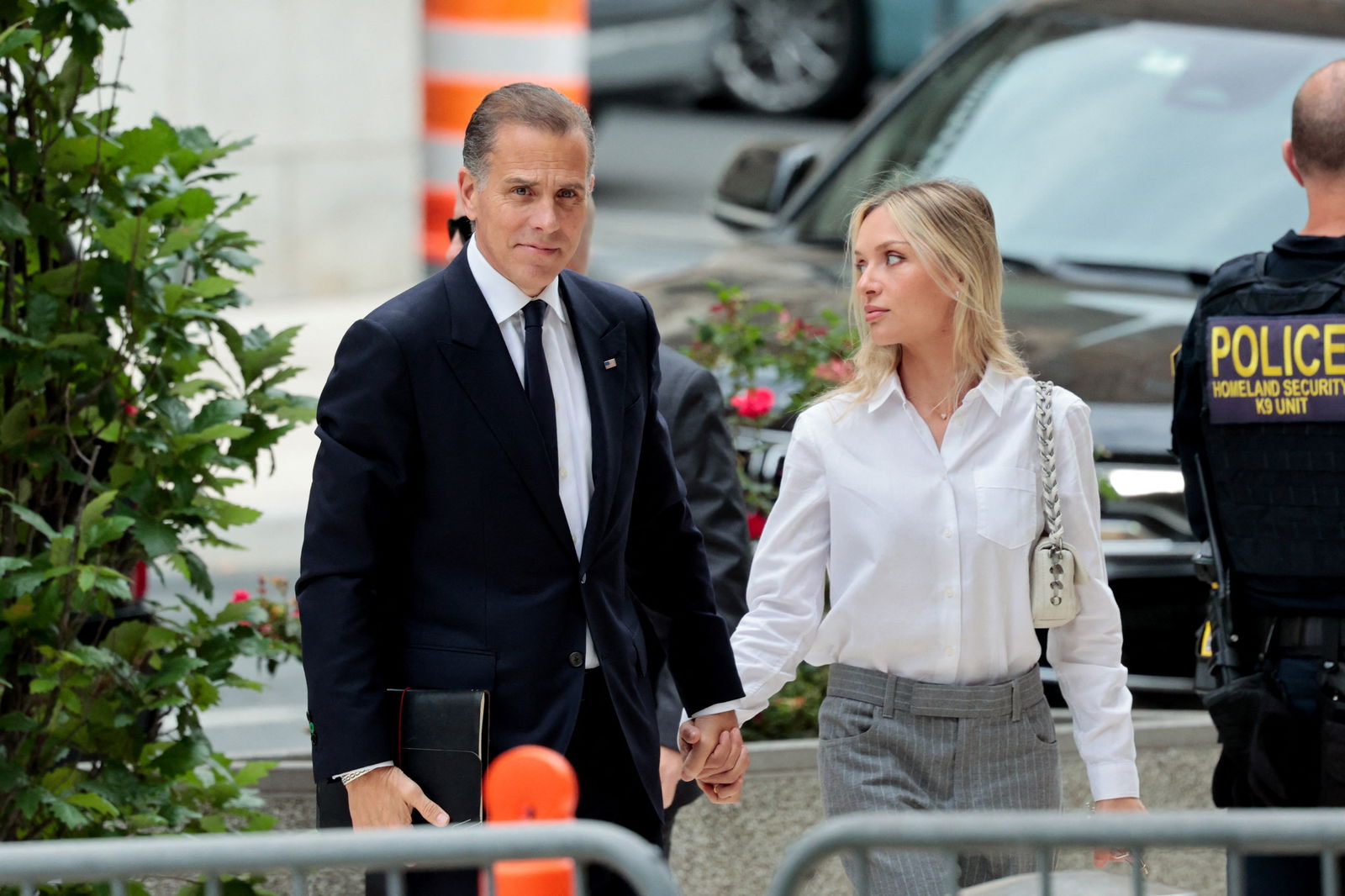 Hunter Biden, son of President Joe Biden, and his wife Melissa Cohen Biden walk outside the federal court as his trial on criminal gun charges continues, in Wilmington, Delaware, June 11, 2024.