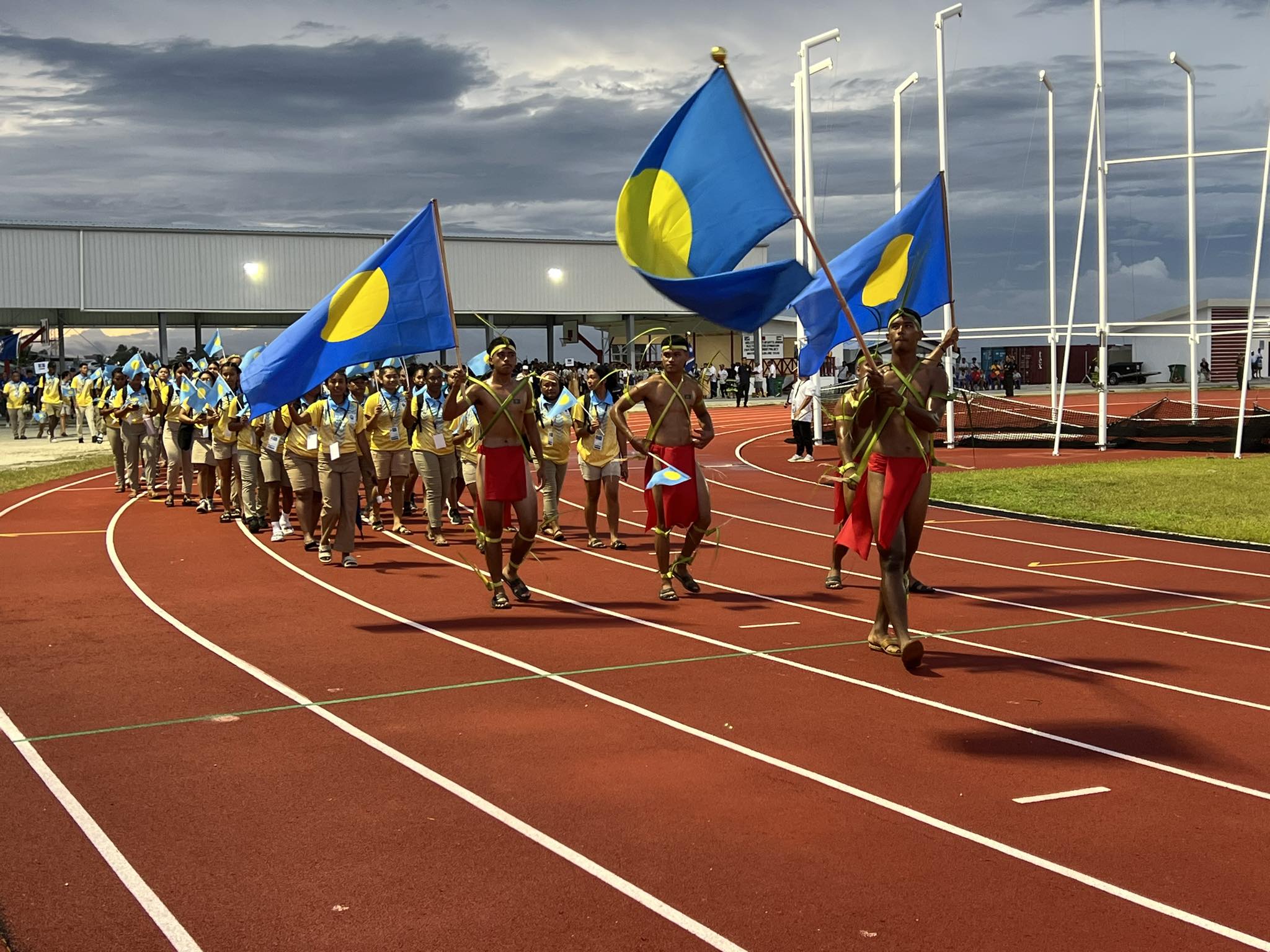 Team Palau marches along the new track field in Majuro for the opening of the 10th Micronesian Games in Majuro.