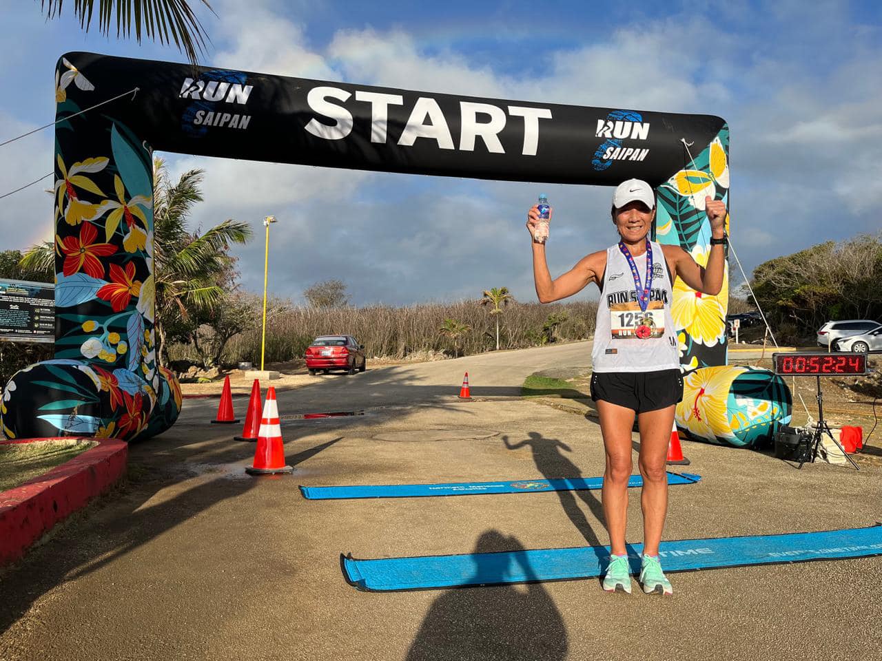 Akiko Miller poses for a photo after finishing first overall in the female division of Run Saipan's 3rd Annual Grotto 10K ‘24 at the Grotto on Saturday morning.