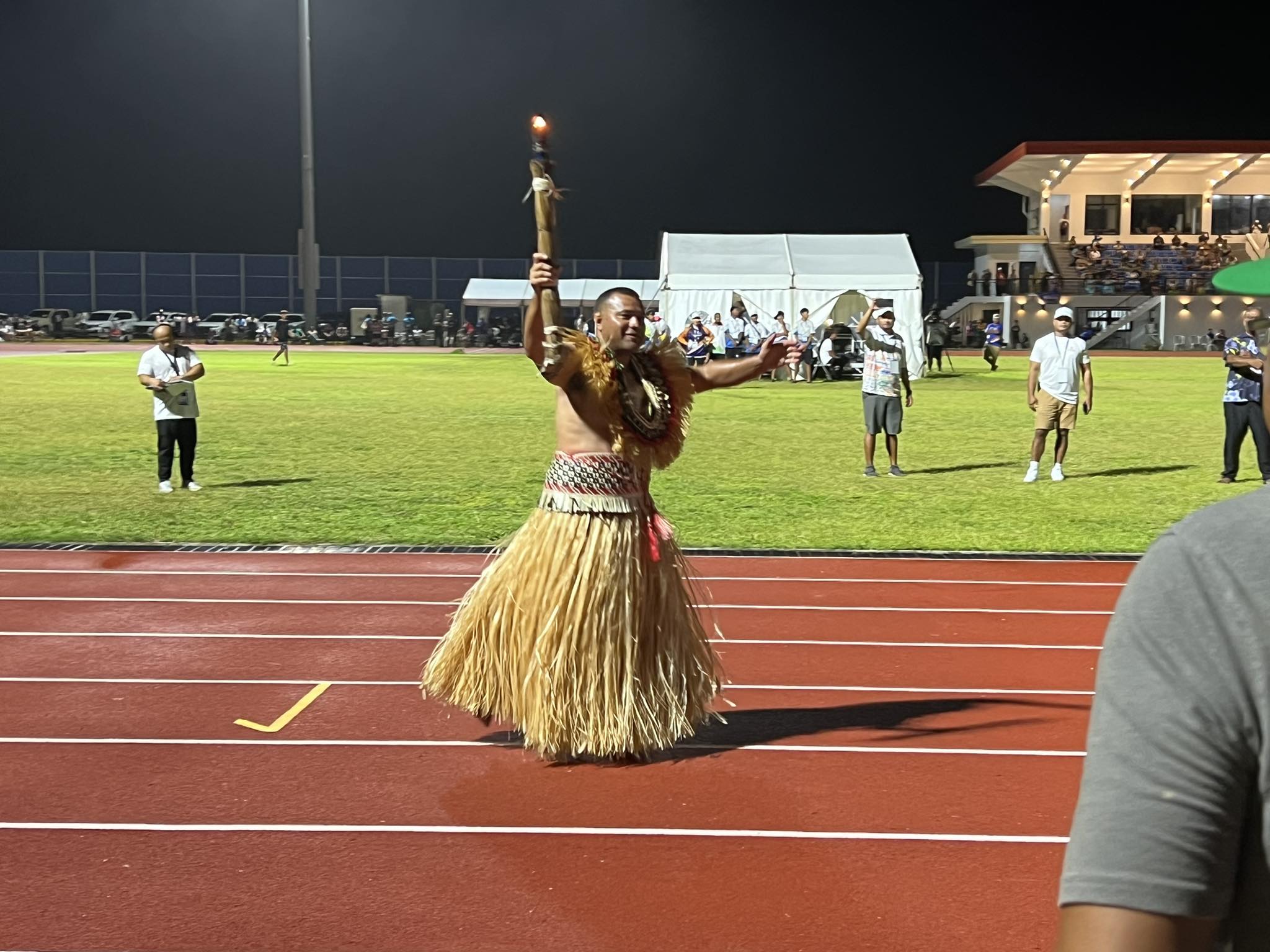Waylon Muller, the most-medaled athlete in Marshall Islands history, carried the torch to light the Games flame during the opening ceremony for the Micronesian Games.