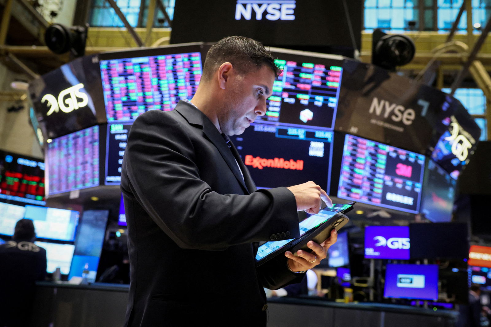 Traders work on the floor at the New York Stock Exchange in New York City, May 8, 2024. REUTERS