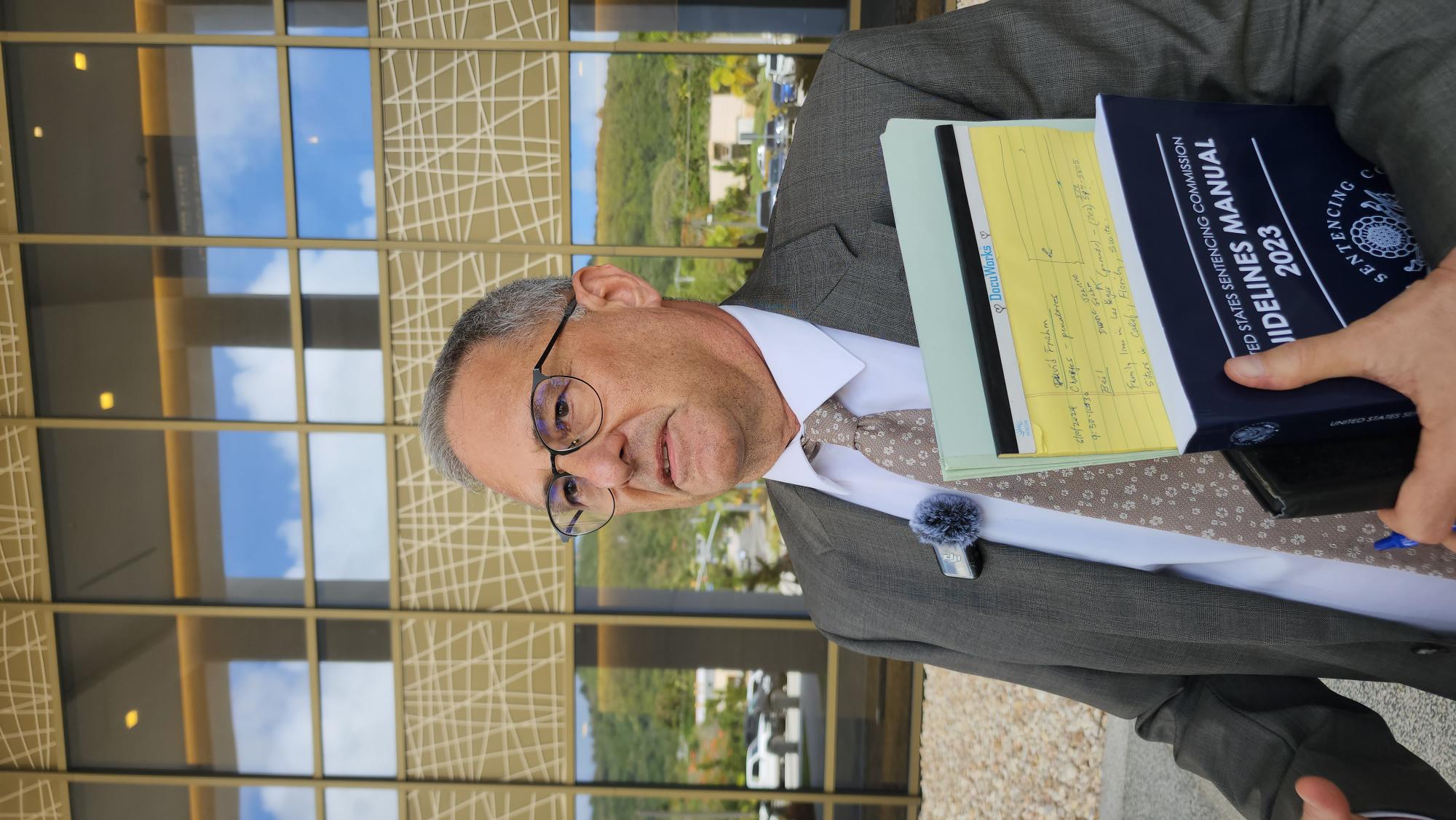 Attorney Richard Miller, appointed by the federal court to represent David Matthew Frahm, talks to reporters after the hearing on Monday afternoon.