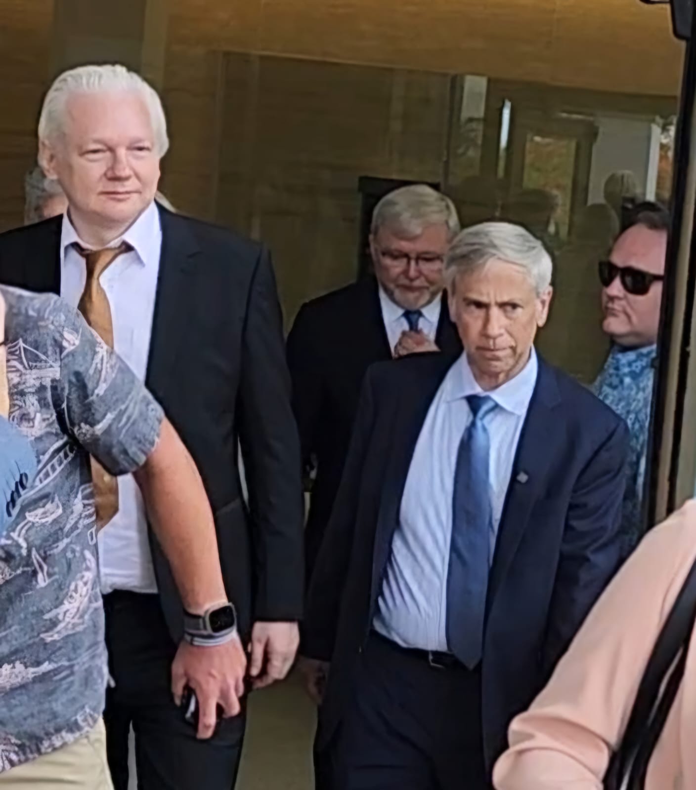 Julian Assange, left, leaves the U.S. Courthouse in Gualo Rai on Tuesday morning.