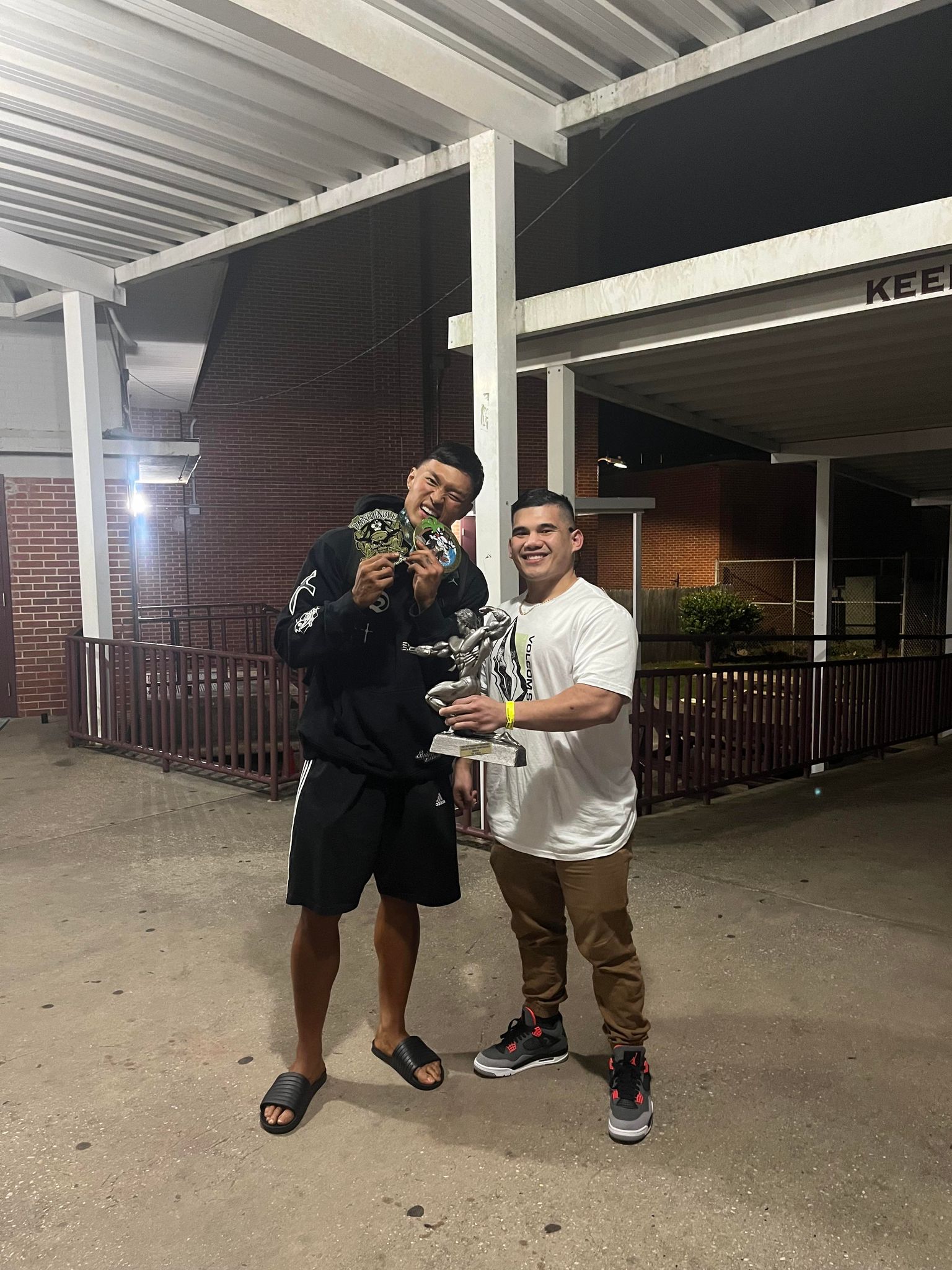 Mike Arciaga, left, with his coach Dicky Feria.