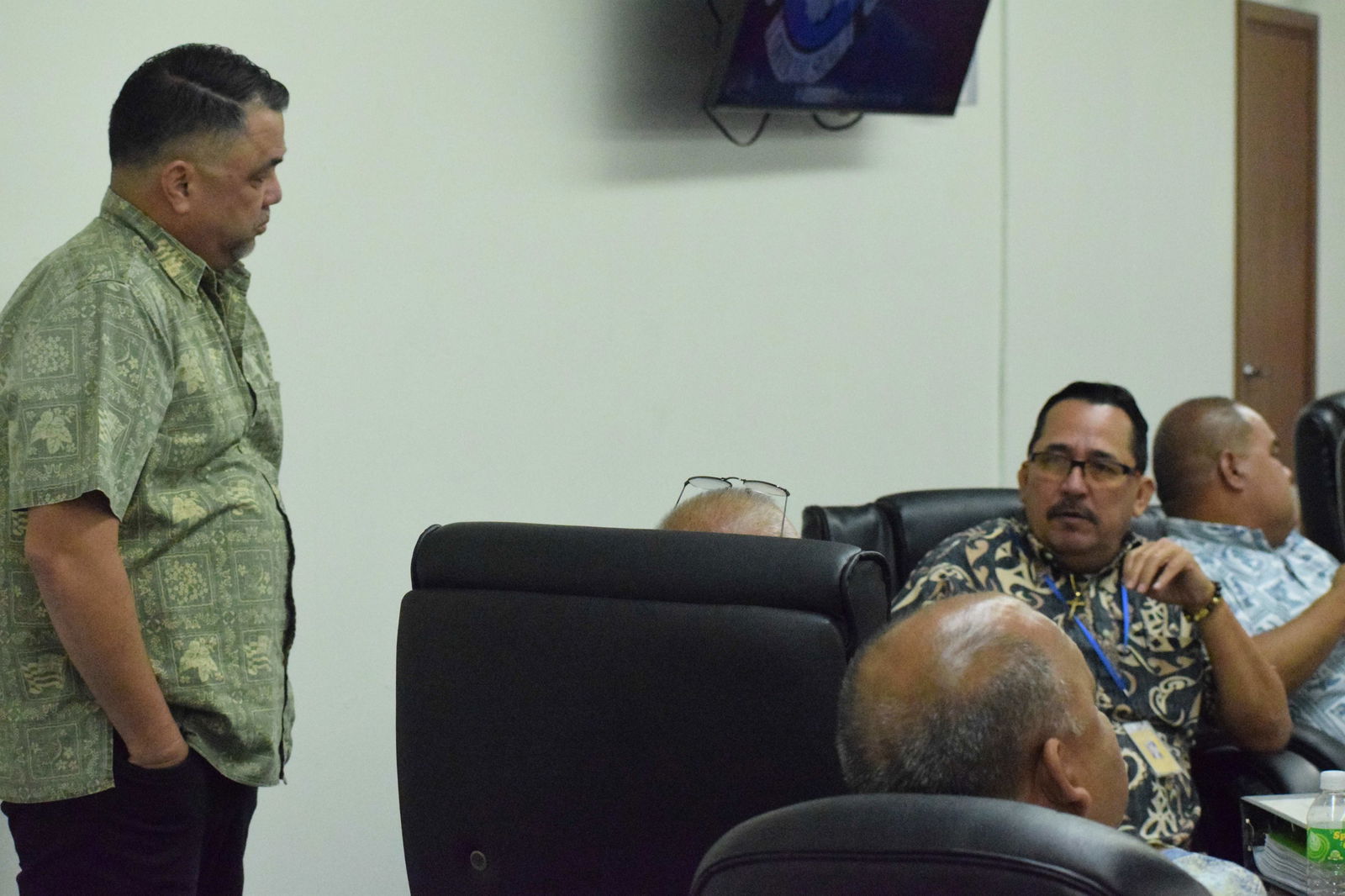 Rep. Patrick San Nicolas, right, talks with Rep. Ralph N. Yumul during a break from a House session on Tuesday.