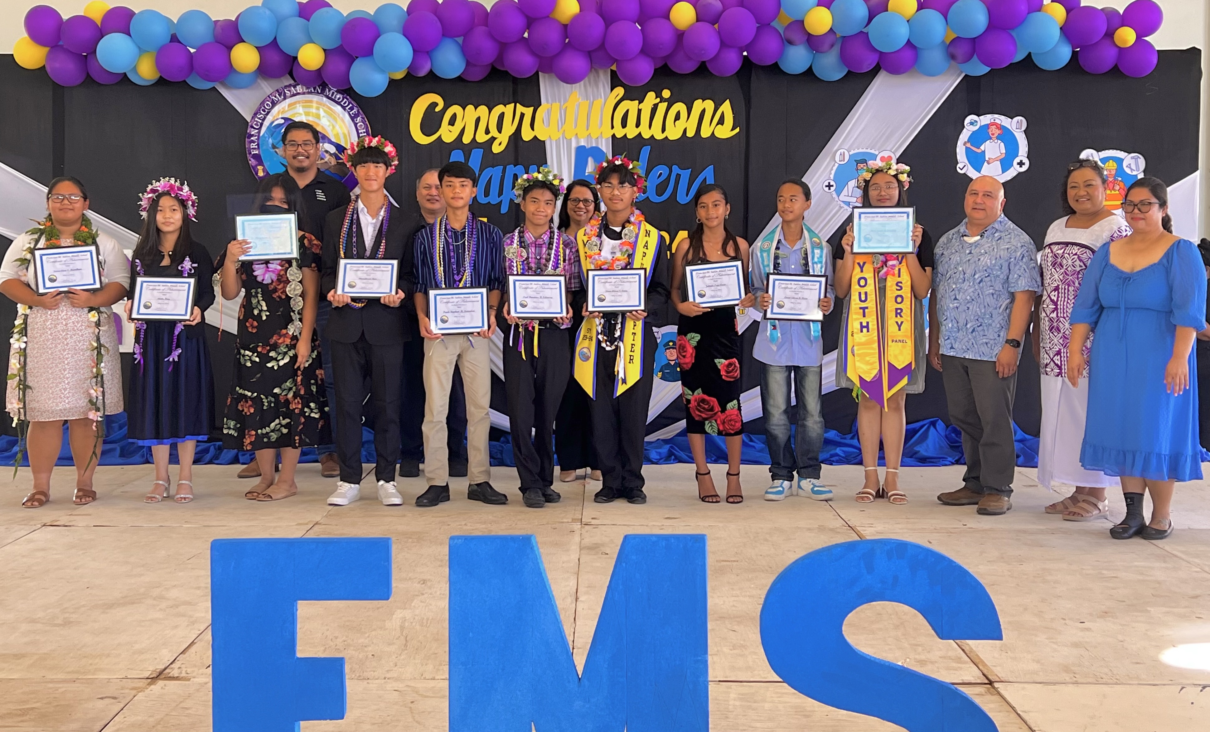 The recipients of the various subject awards pose for a photo.