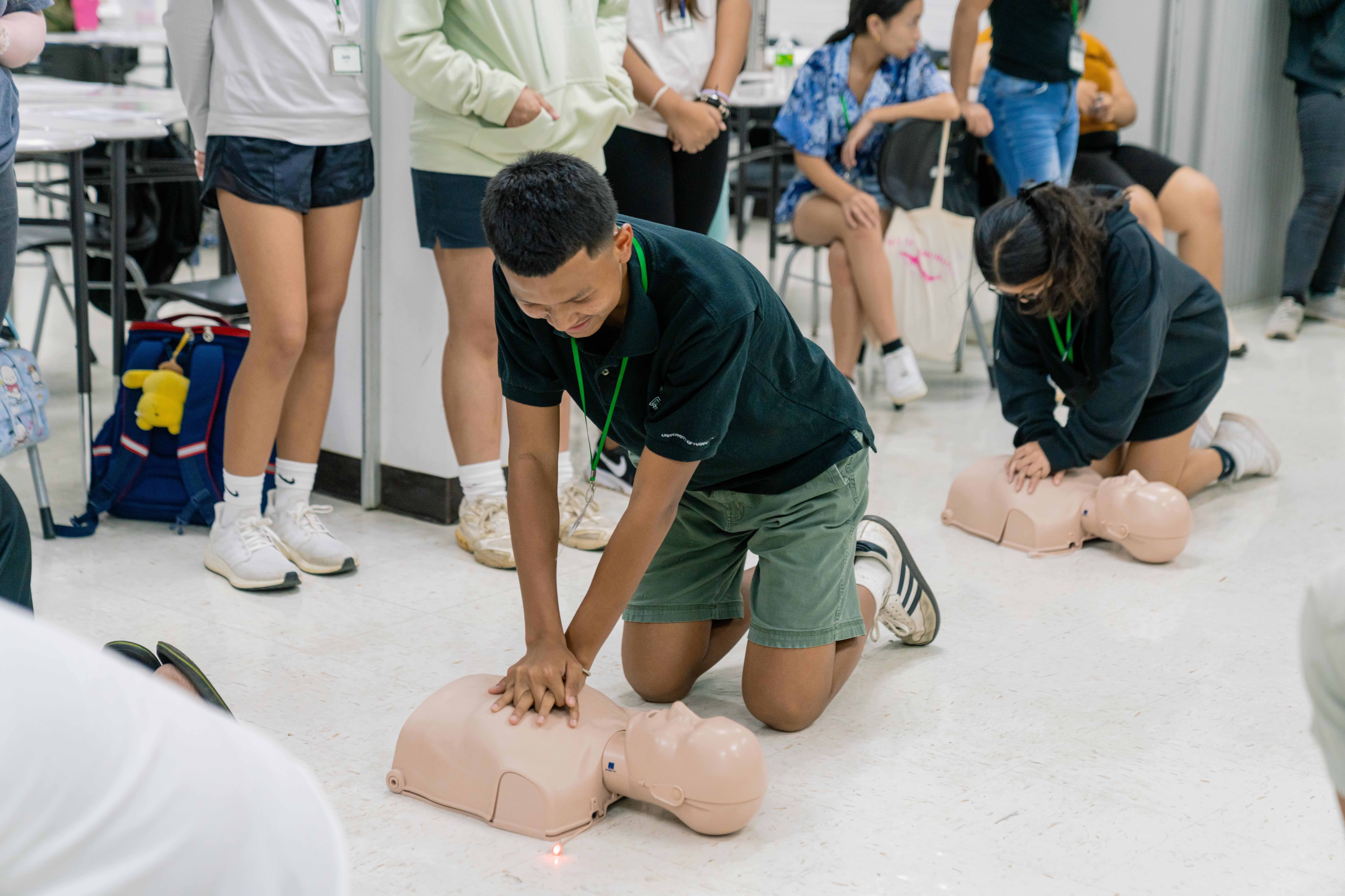 Tinian Junior-Senior High School student Justice Aldan learns how to perform CPR.