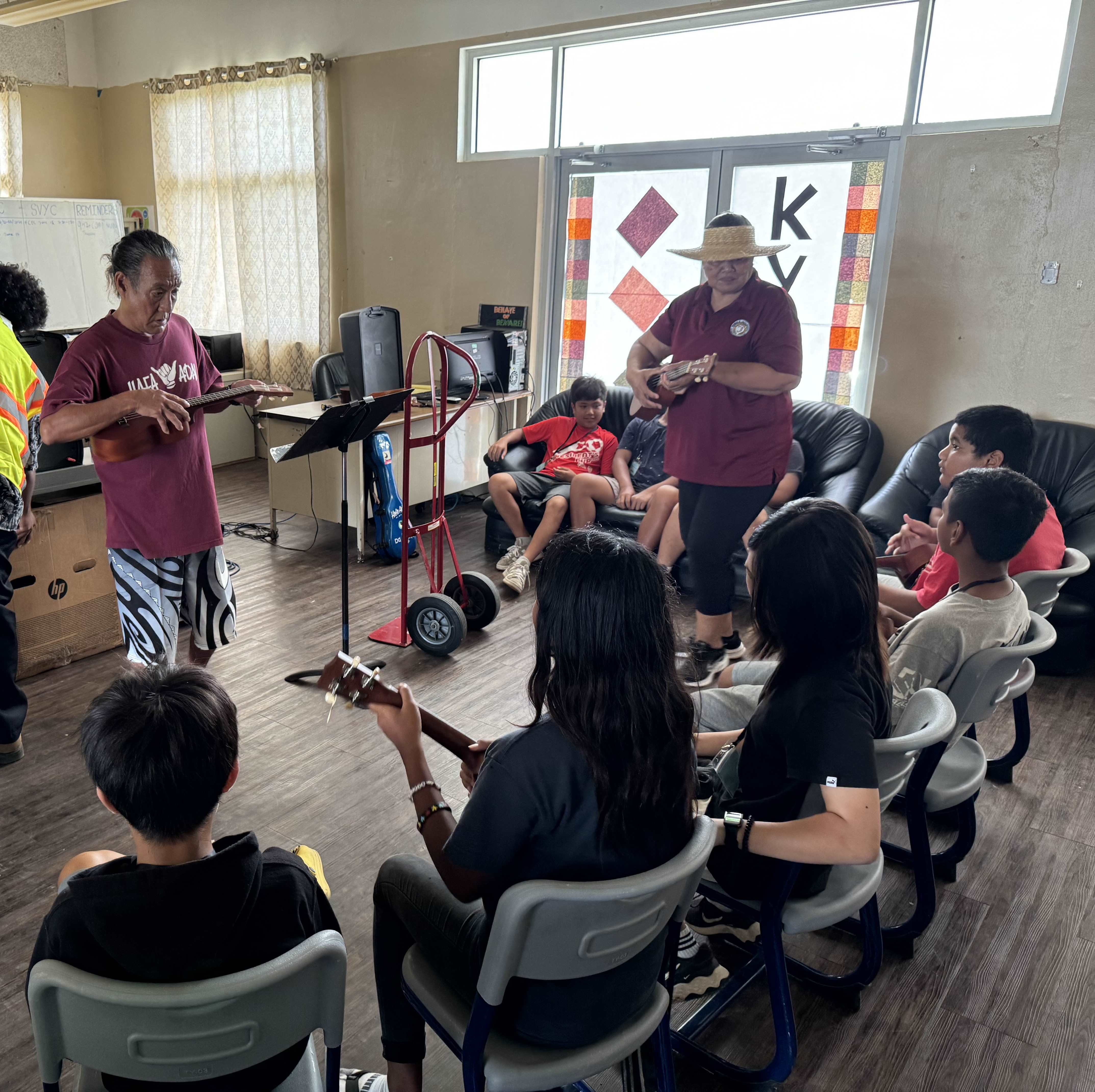 Local performing artist and MTEC Board Member Larry Lee, left, teaches the “Hafa Adai” song at the Marianas Tourism Education Council and Marianas Visitors Authority’s outreach in Koblerville on July 24, 2024.  