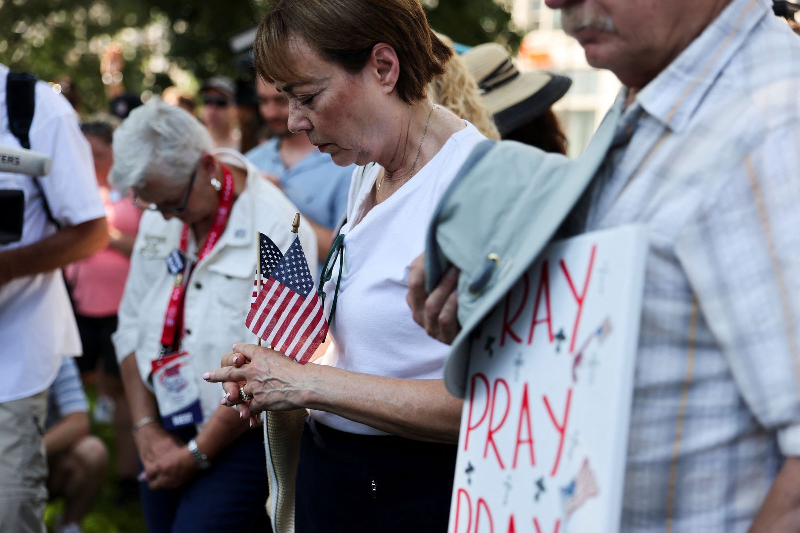 Supporters of former President Donald Trump attend a prayer vigil hosted by Turning Point Action near the venue for the Republican National Convention at Zeidler Union Square in Milwaukee, Wisconsin, July 14, 2024.